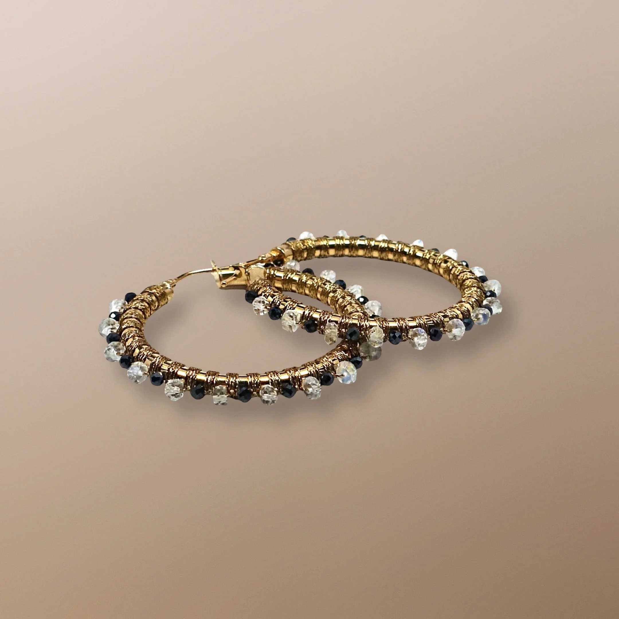 AQE121YG 14KT HOOP HAND WOVEN WITH BLACK SPINEL AND RAINBOW MOONSTONE, ALSO. MOON STONE IS BALANCING AND INTROSPECTIVE, SPINEL: STONE OF IMMORTALITY