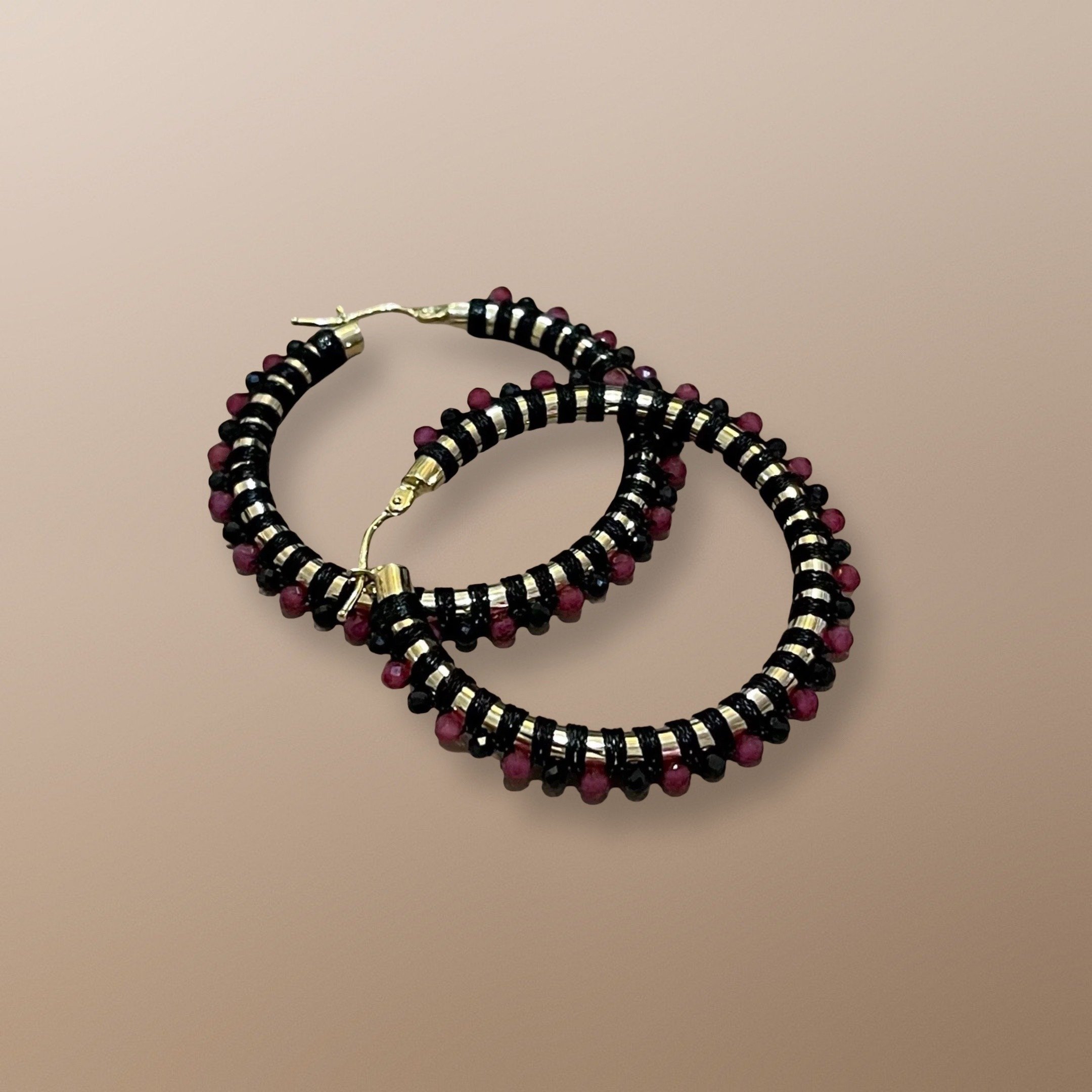 ELR103 14KT YELLOW GOLD HOOP HANDWOVEN WITH RUBY, BLACK SPINEL, AND BLACK CORD
