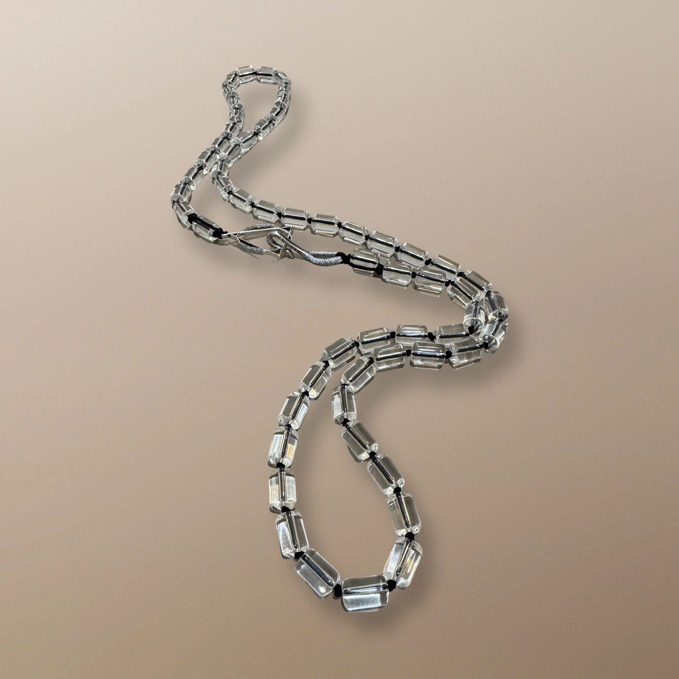 NANDA110	12MM X 6MM QUARTZ CYLINDERS WITH 30MM STERLING SILVER LOGO CHARM AND STERLING SILVER SIGNATURE CLASP 36” 2.JPG