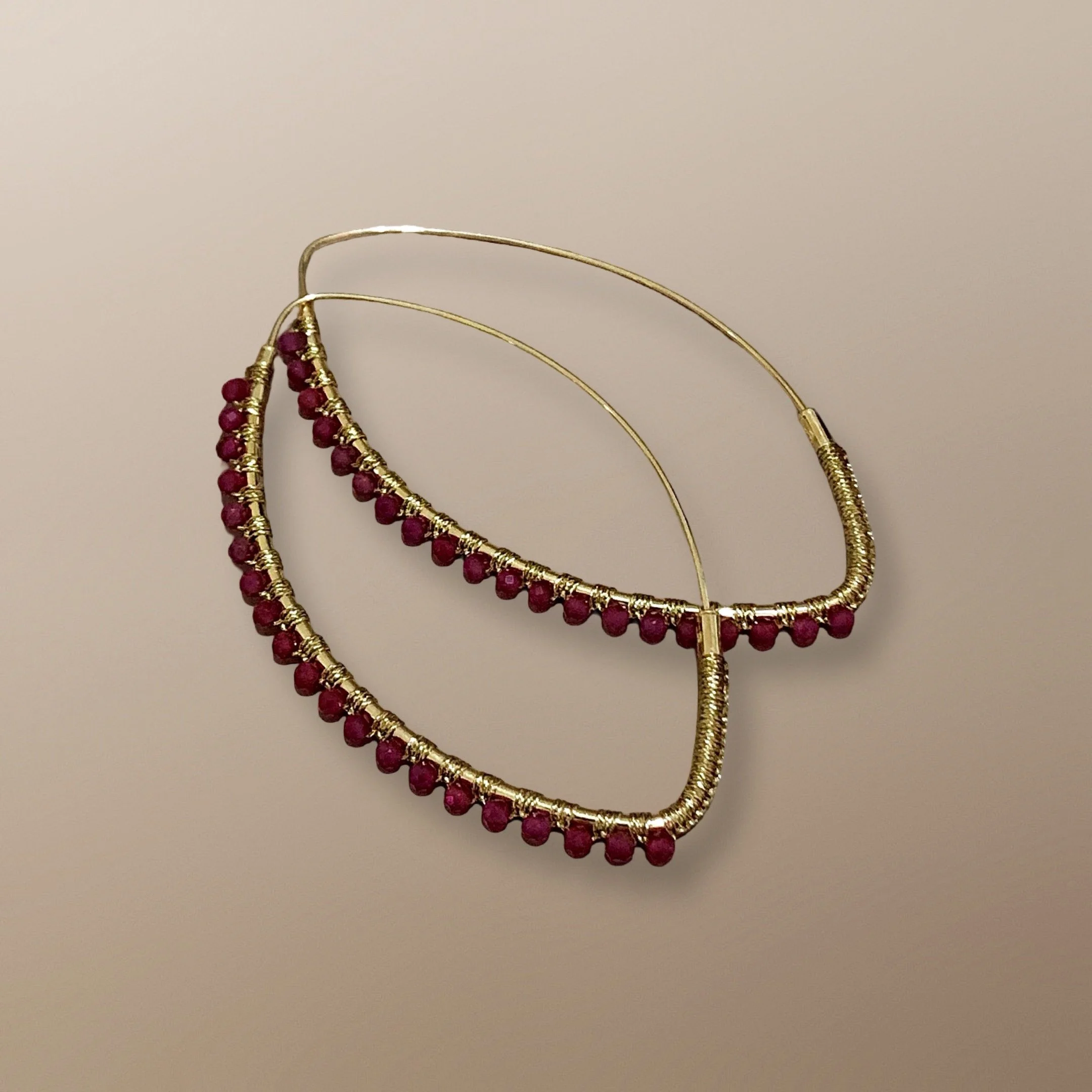 ENG108YG 59X33MM 14KT YELLOW GOLD VESICA PISCIS HOOP HAND WOVEN WITH RUBIES 1.JPG