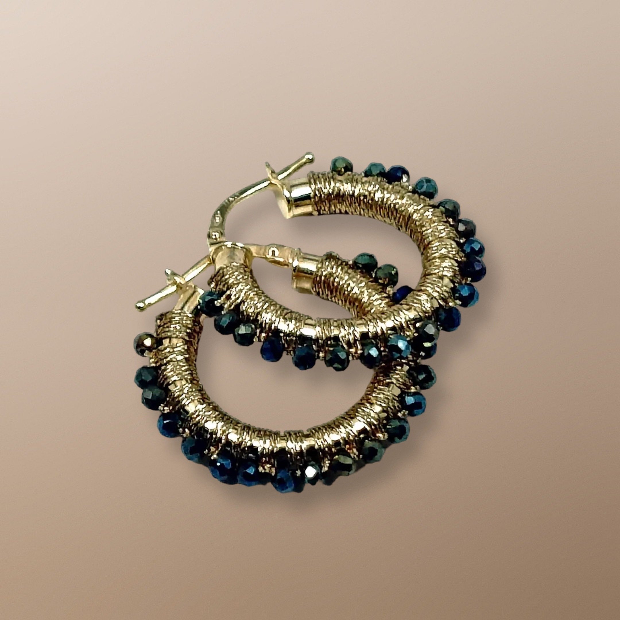 NME105-109 14KT GOLD HOOPS HAND WOVEN WITH GREEN SPINEL. AVAILABLE IN YELLOW, ROSE, OR WHITE GOLD, AND FIVE SIZES. SPINEL IS THE STONE OF IMMORTALITY 3.JPG