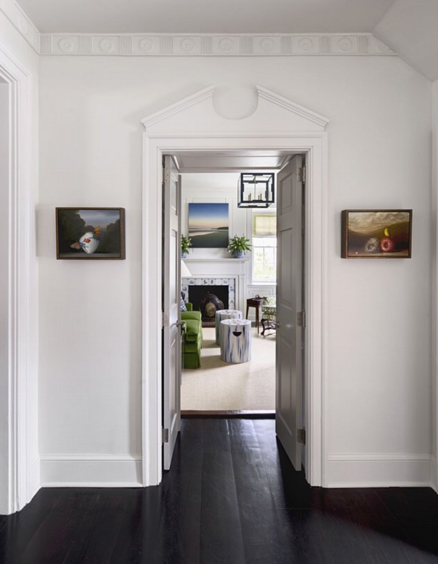 a pair of paintings by david kroll in entry