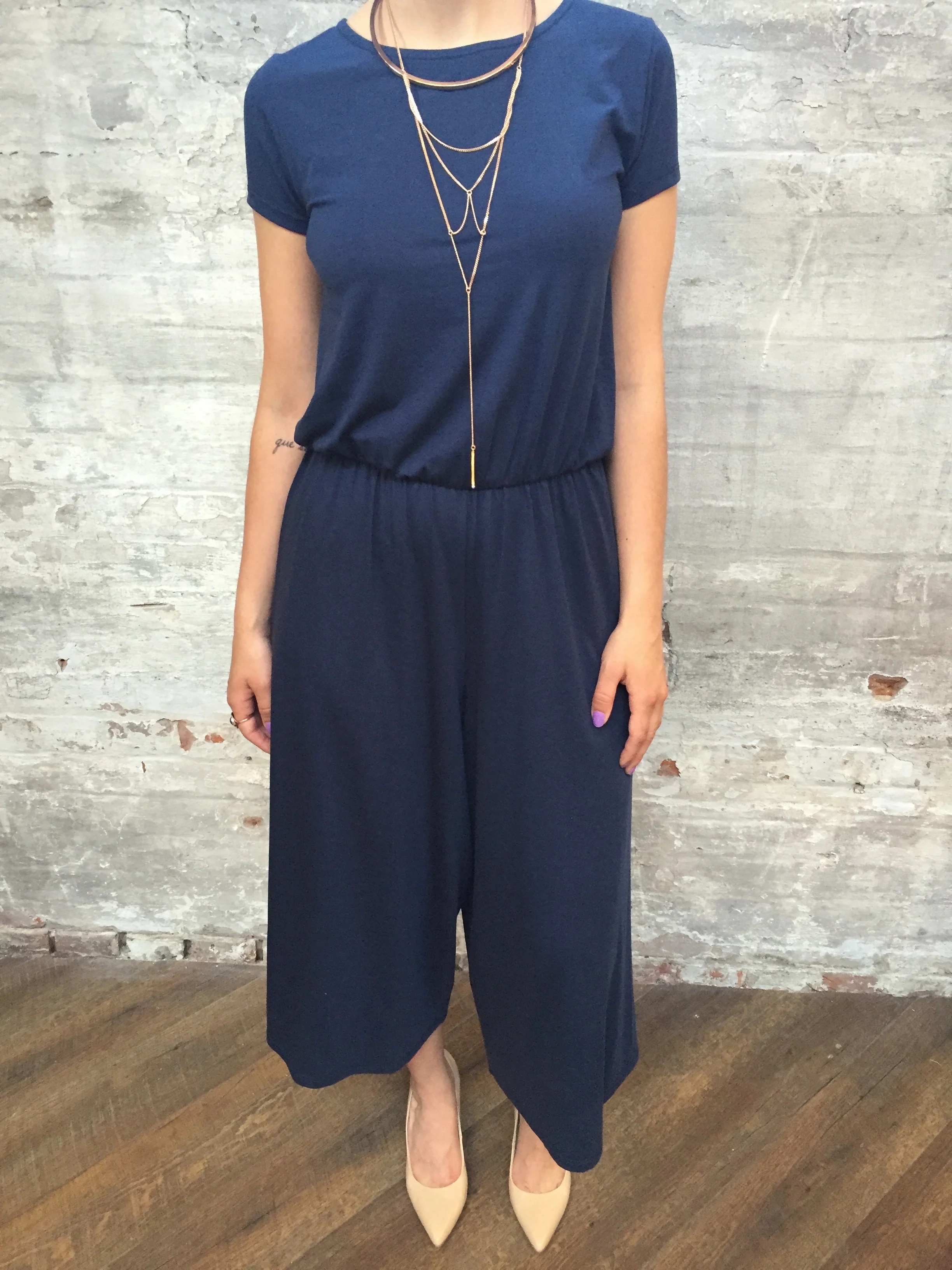American Vintage Cropped Jumpsuit $198 Jenny Bird Neith Necklace $140 Tiger of Sweden Leather Pumps $249