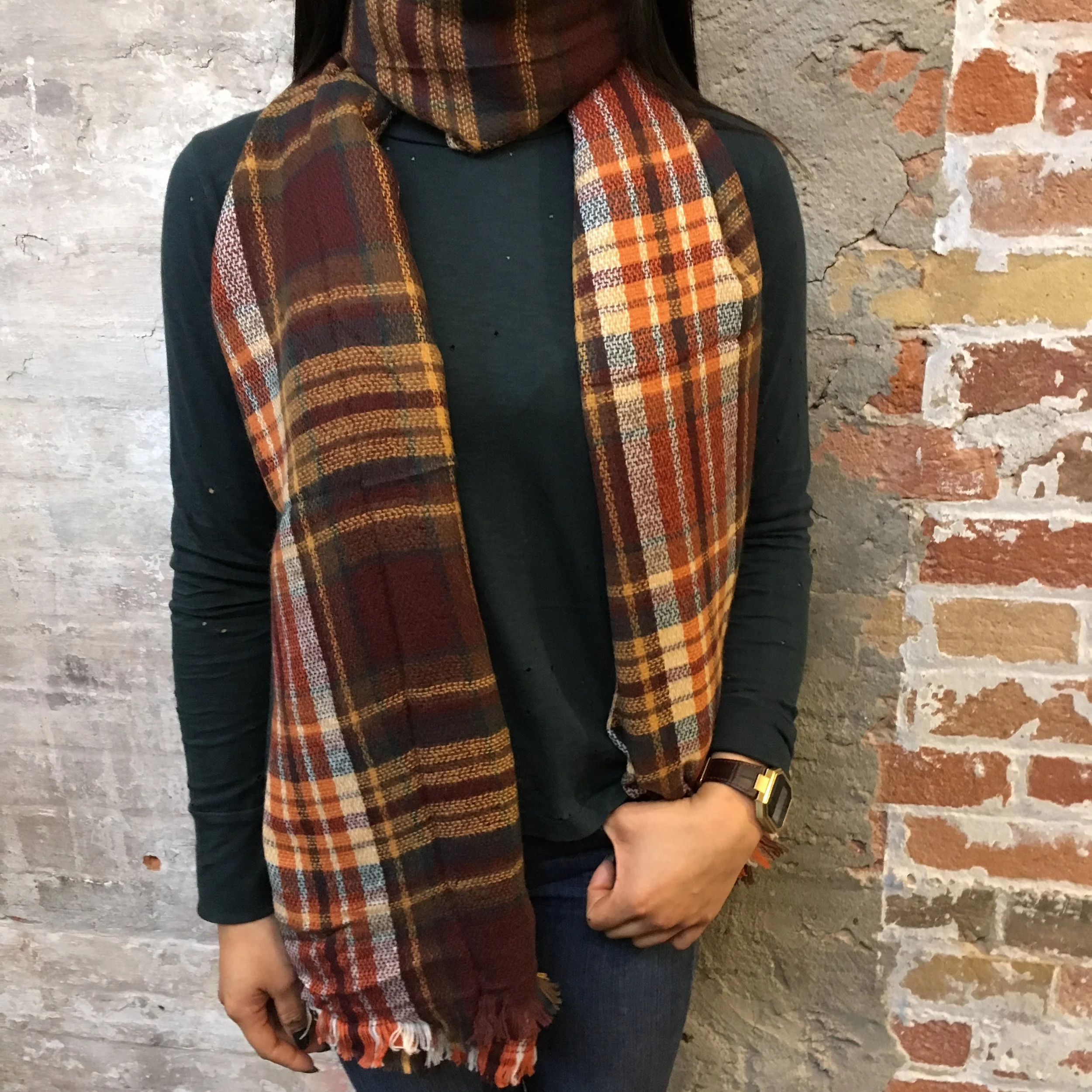 The Go To: Just wrap your scarf around and let the two ends drape in front of you. This simple yet elegant look can be adjusted for however loose or tight you want the neck to be. Works well with jackets but can also be transitioned to an elegant look with a skinnier scarf.