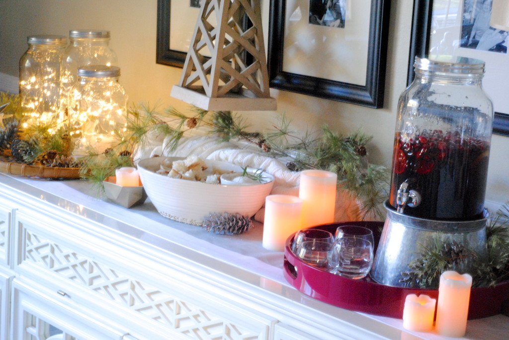 Love this Christmas buffet from makinglemonadeblog.com. Cranberries in glass beverage dispenser bring in the color of the season.