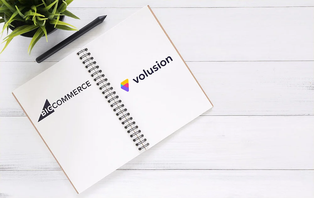 Bigcommerce vs Volusion — image of the two logos side by side on a notepad