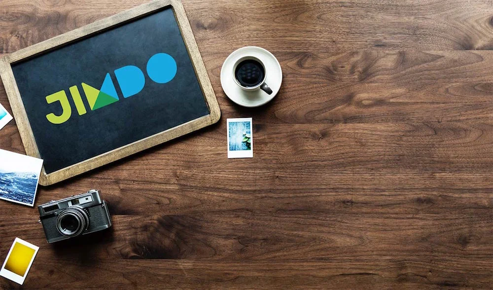 Jimdo review - image of blackboard with the Jimdo logo on it