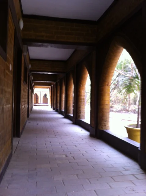 Cloister inspired walkway outside guest rooms