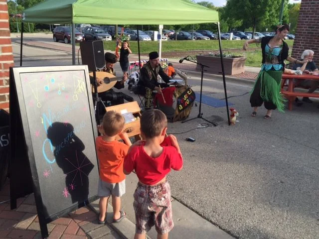 It was great to be outside under the setting sun at this wonderful farmers market. It is in the open space near the train depot in Whitewater. Thanks to Leah for dancing! We'll be playing here again throughout the summer and autumn. Stop b…