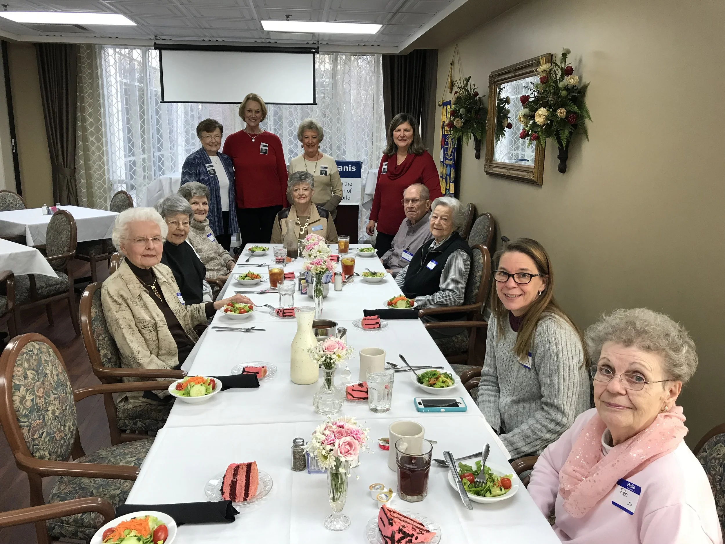 Volunteers working with our Mission in a Mile program, help each month with the Birthday Luncheon for the residents at Talmadge Terrace.