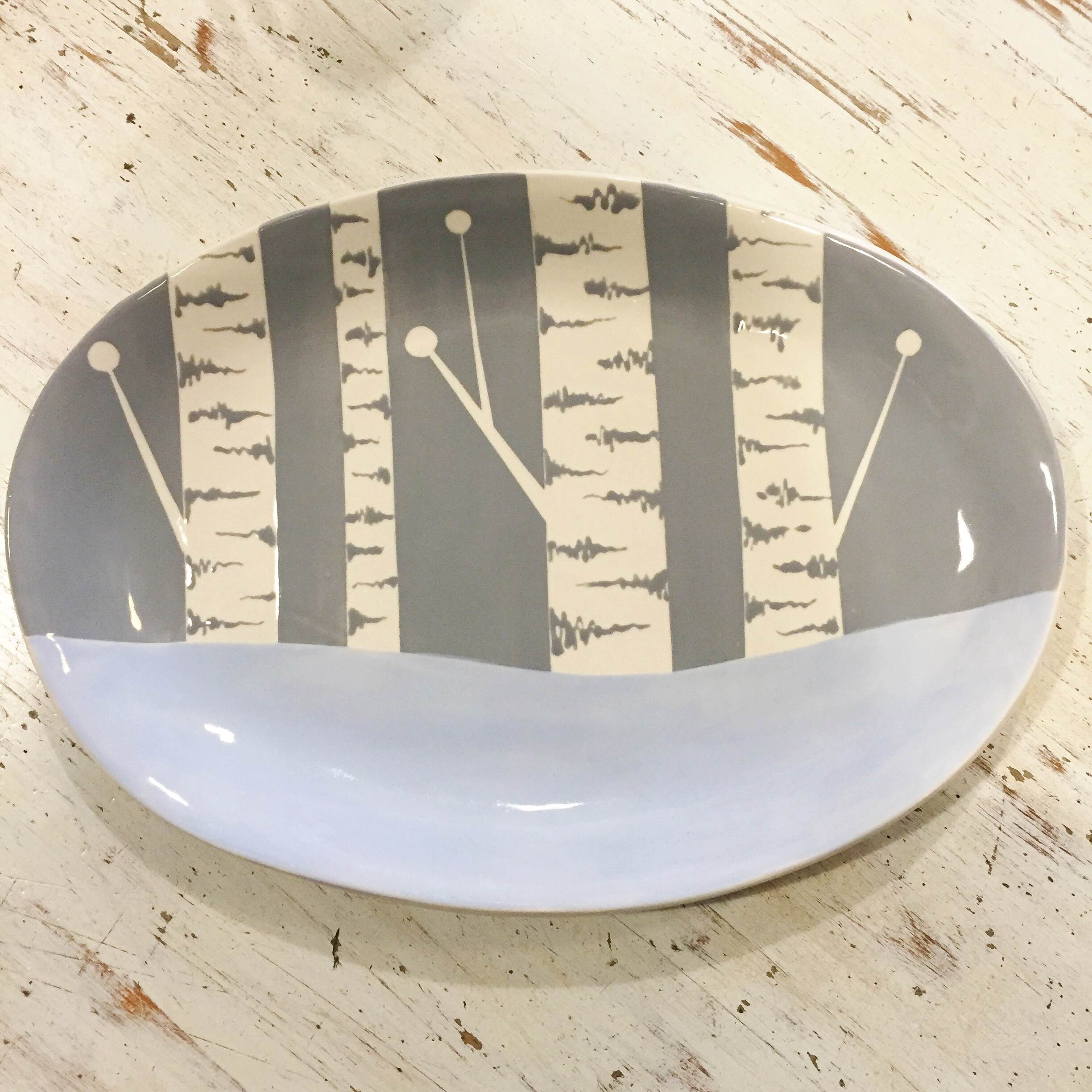 Learn how to paint this beautifully simple birch tree design on any plate you choose with one of our talented artists! Price depends on the size and style of your plate. You can also enjoy a coffee or glass of wine while you paint! Call us to reserve your spot today!