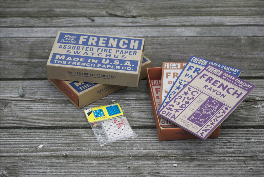 Swatch books and a toy delivered in a slipcase carton.