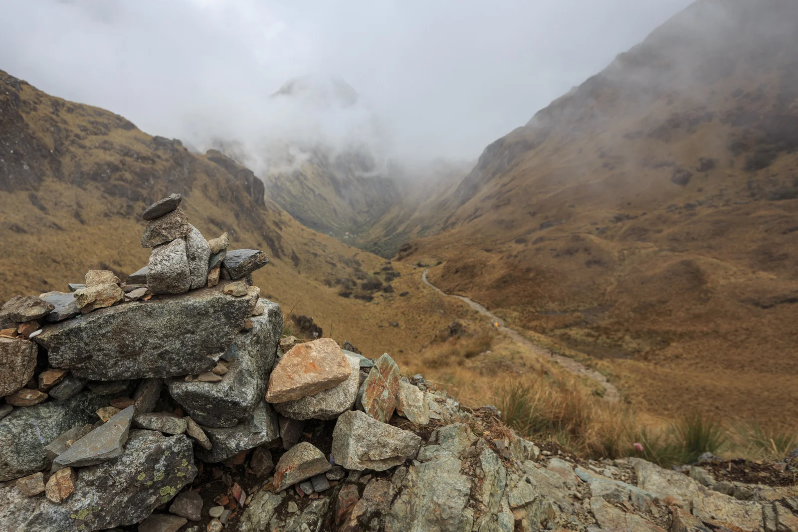 Rock cairn and the view down the other side