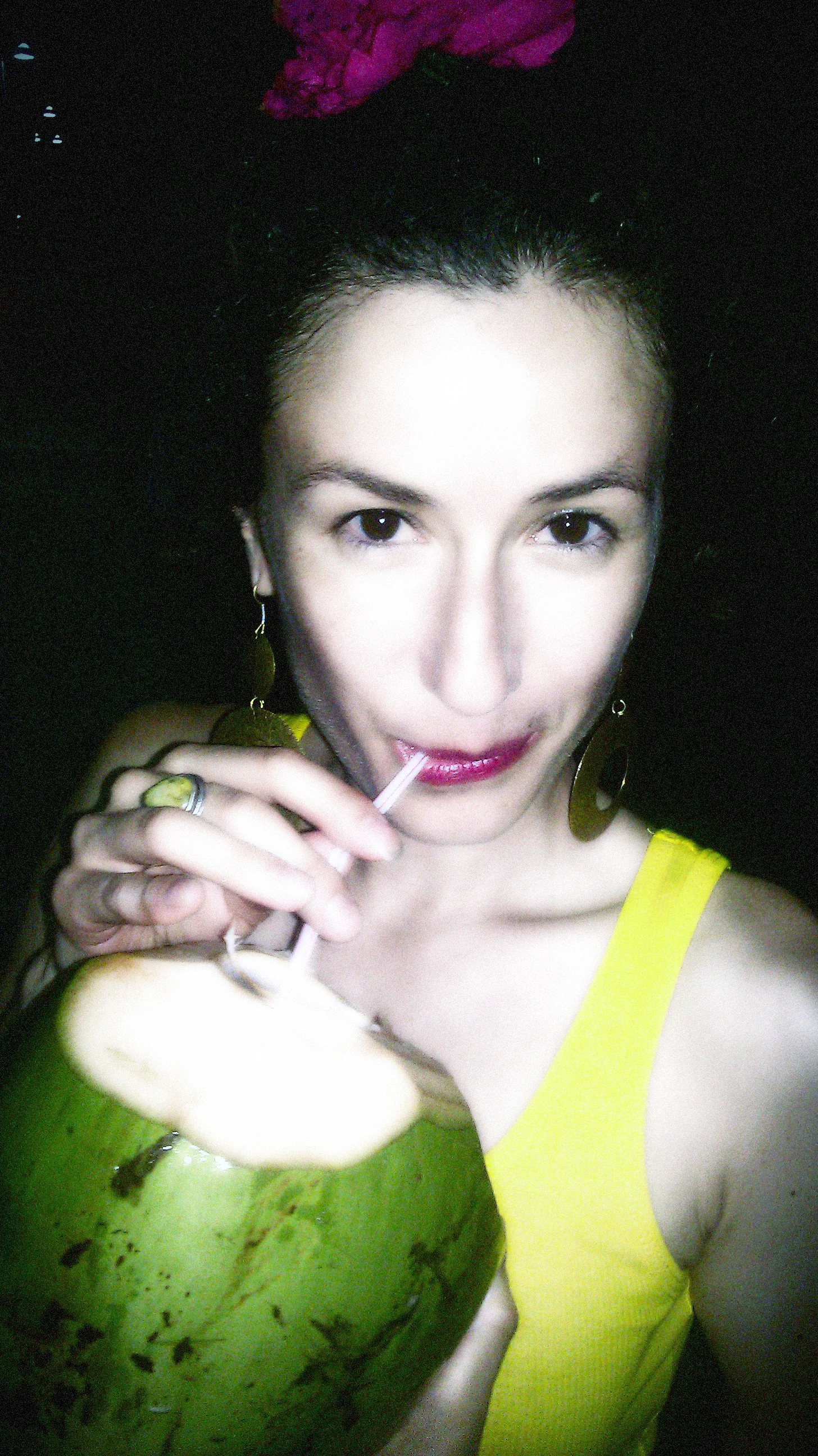 Melinda gets inspiration for her collection while traveling the world. Here she is in Puerto Rico enjoying fresh coconut water.