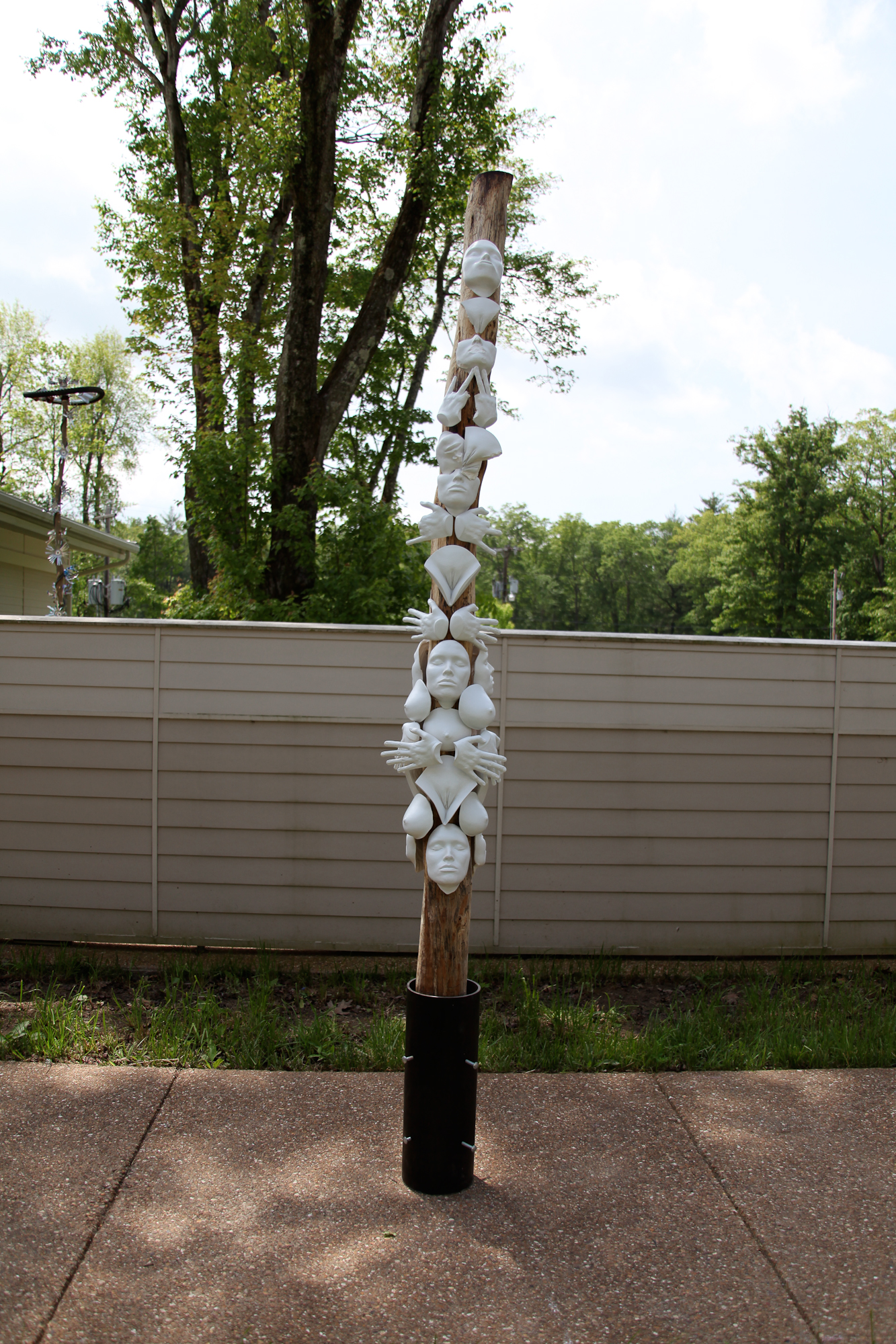   Totem.  &nbsp; &nbsp;2010  Plaster casts, tree trunk, metal 