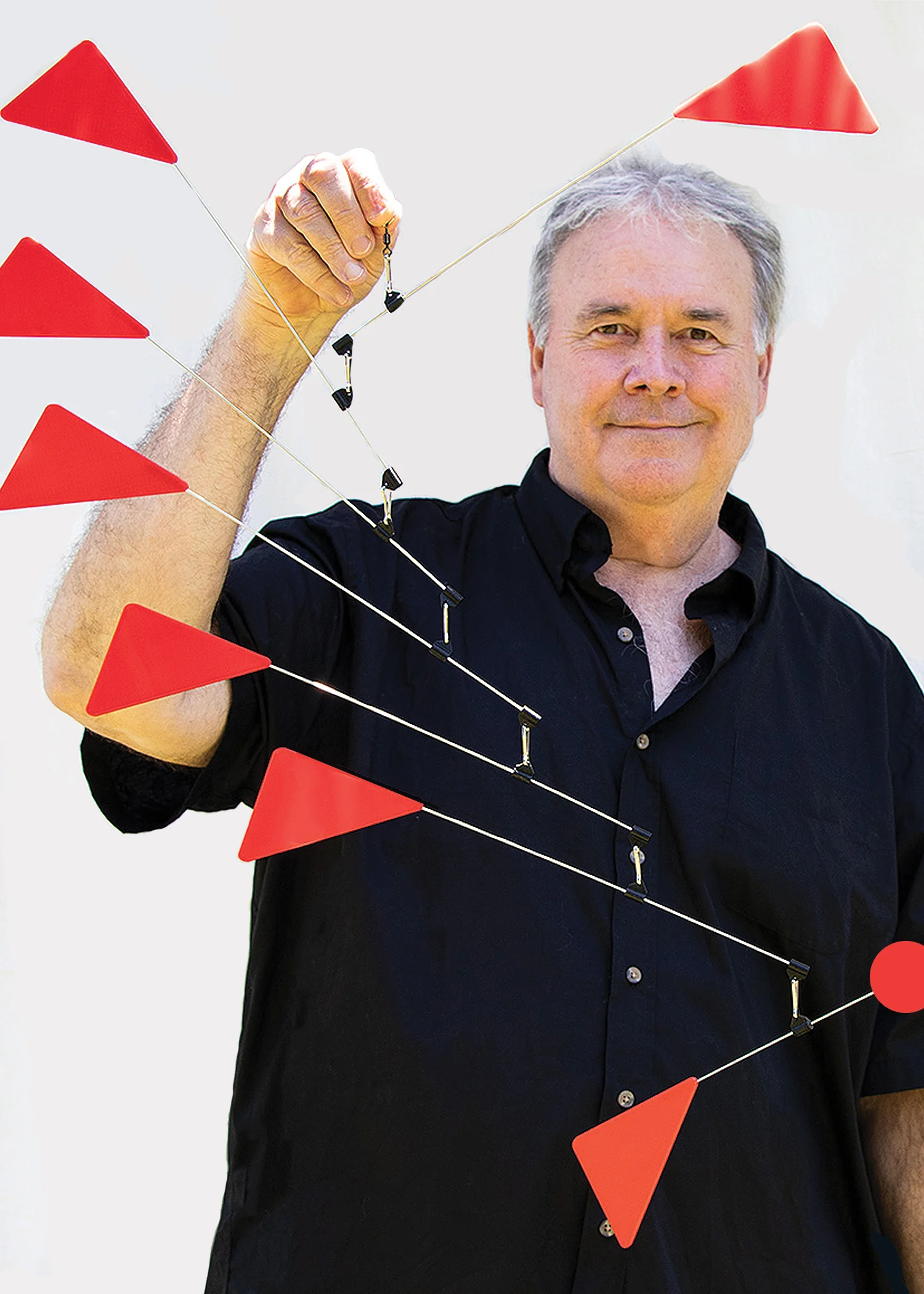 Richard John Jenkins holding Triangles Futura Mobile