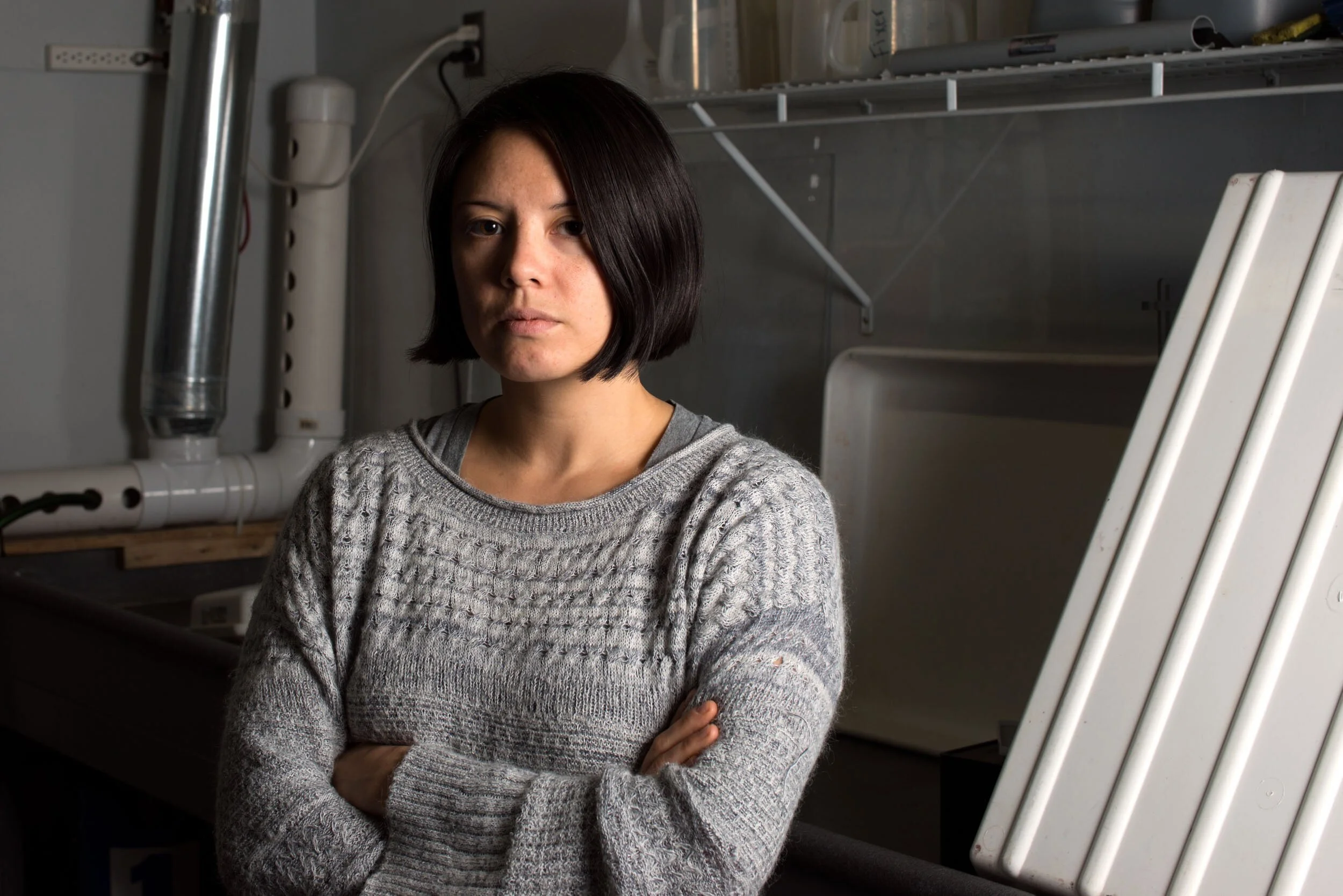 environmental-portrait-woman-workshop-arms-crossed.jpg