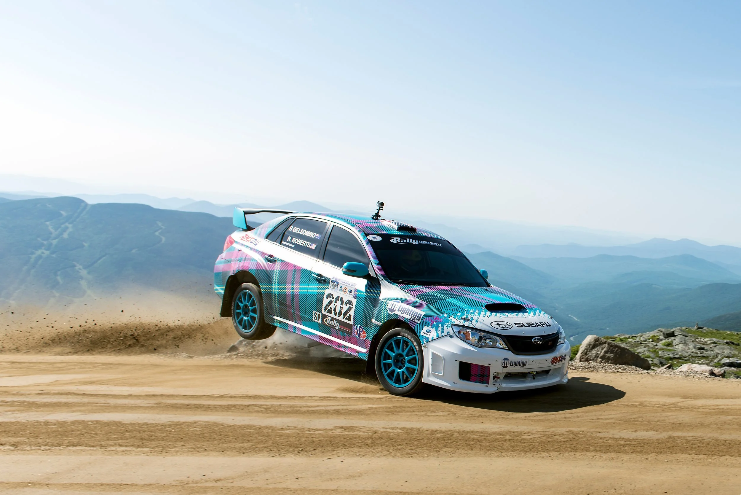 subaru-wrx-sti-rally-sedan-mountain-gravel-road.jpg