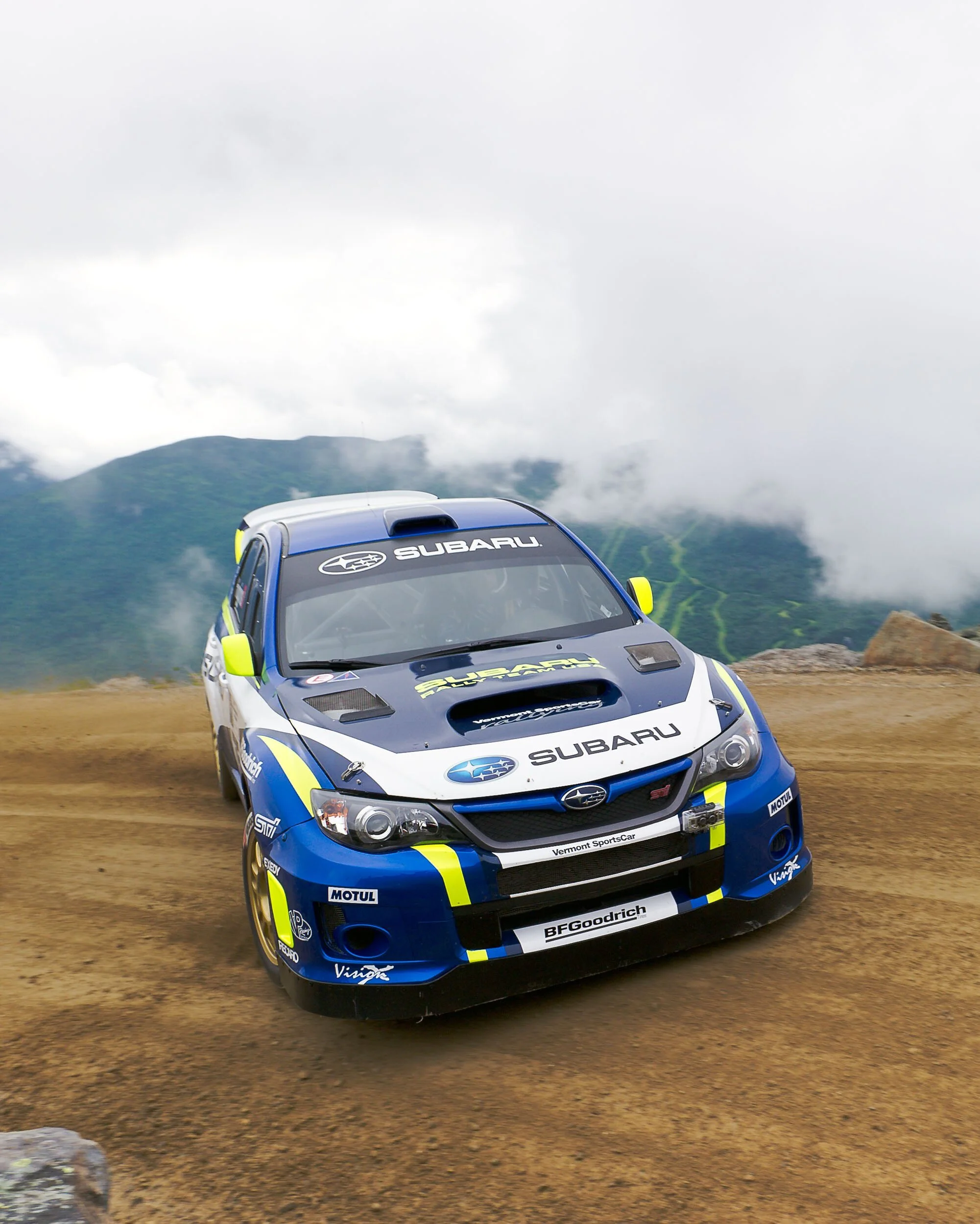 subaru-rally-car-mountain-road-low-clouds.jpg