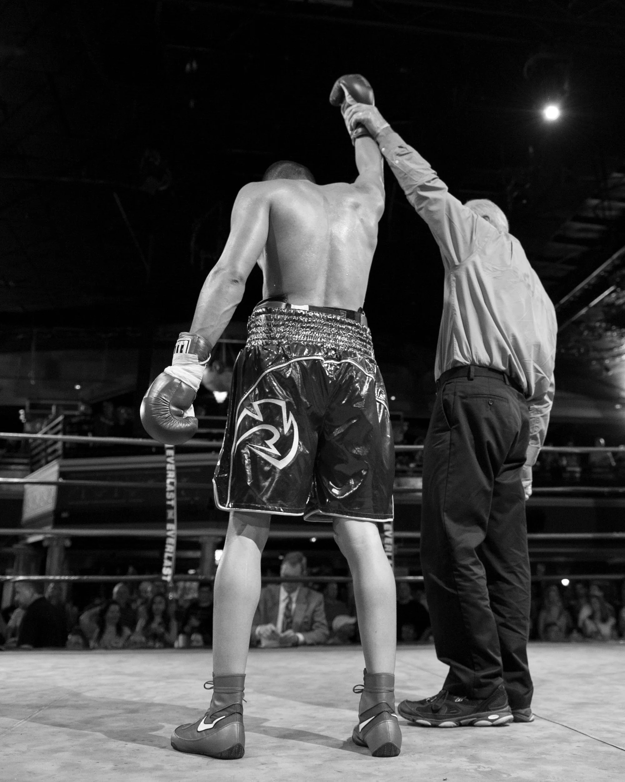 boxing-winner-arm-raised-by-referee.jpg