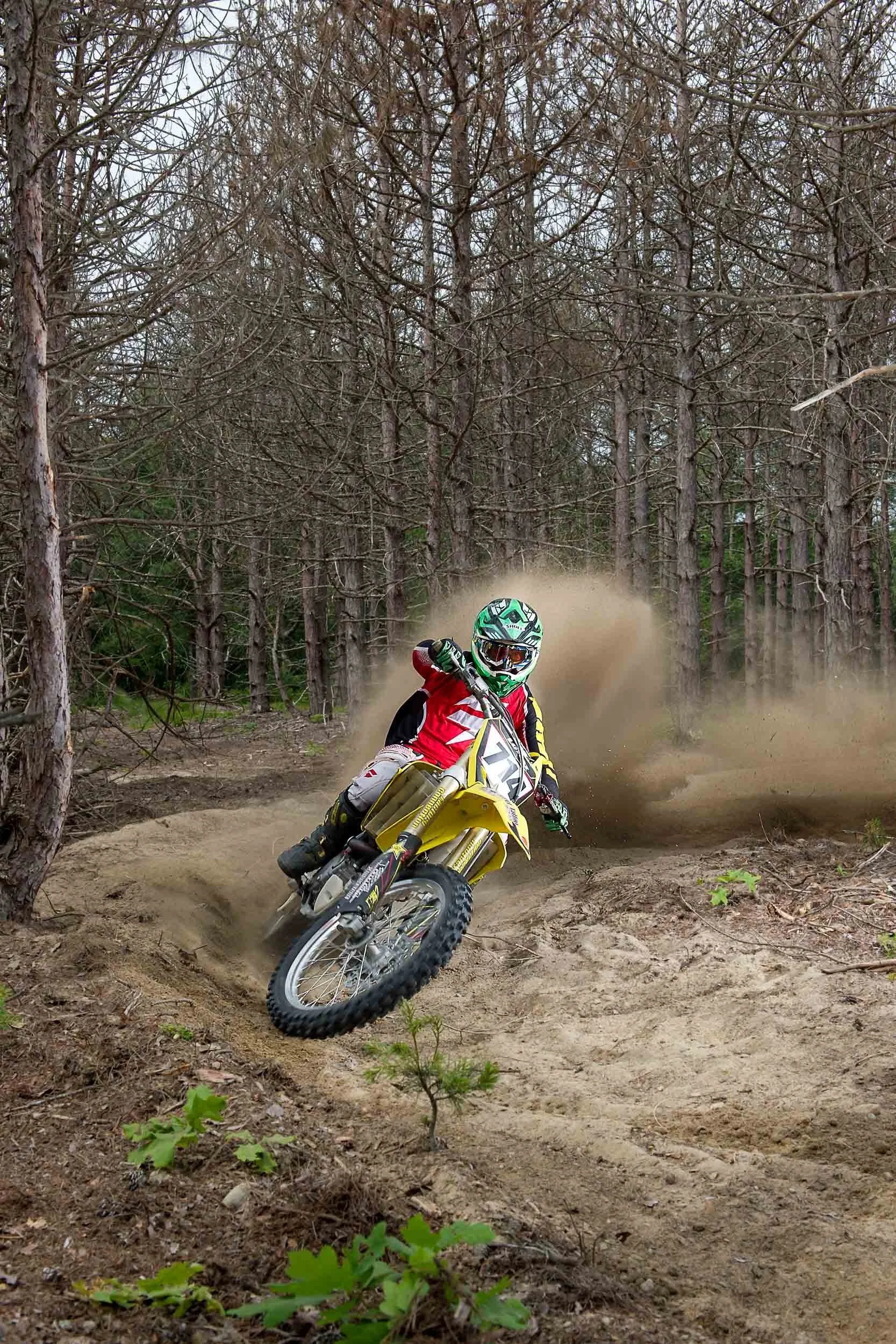 motocross-rider-forest-trail-dust.jpg