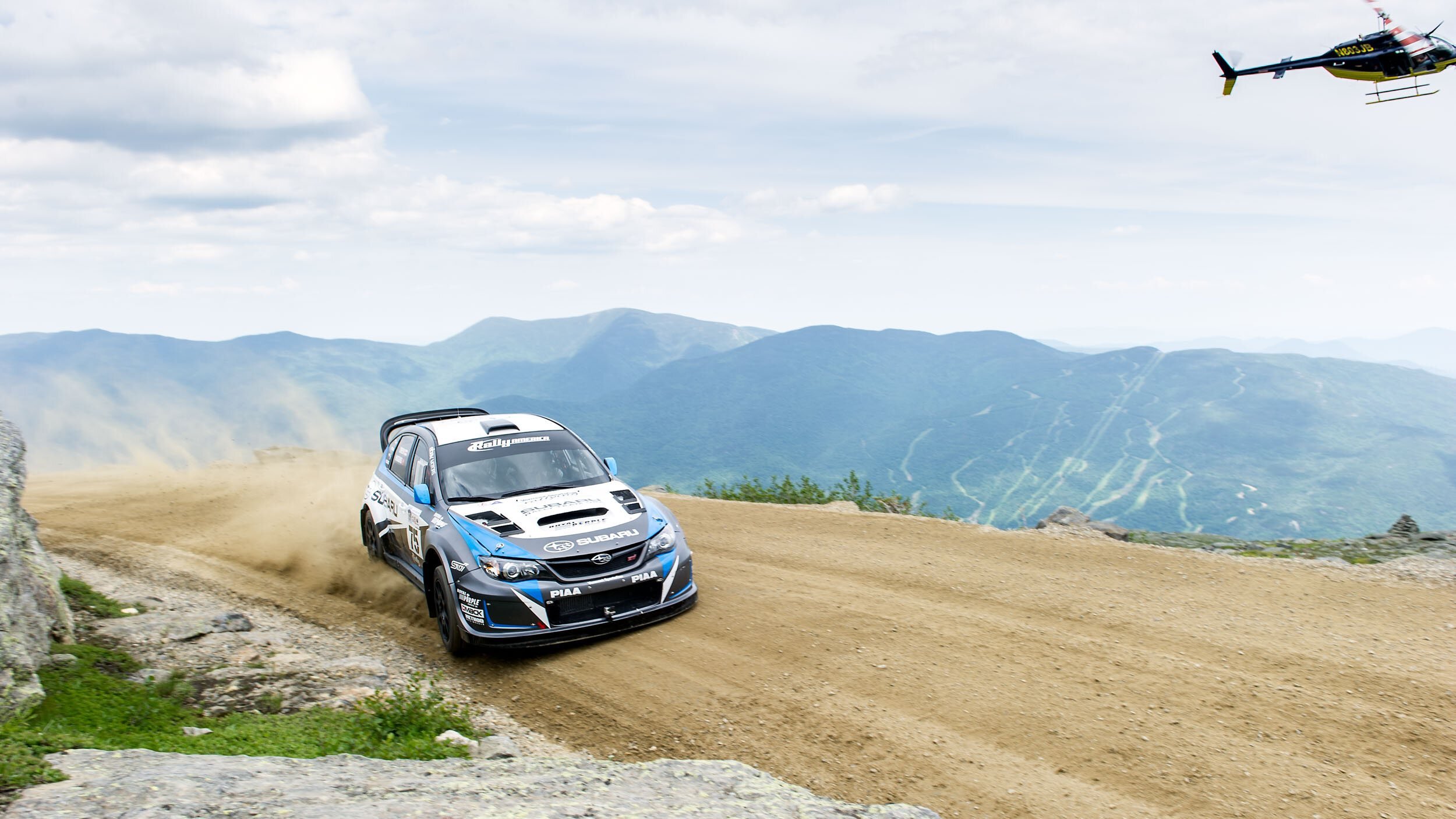 subaru-rally-car-gravel-road-helicopter.jpg
