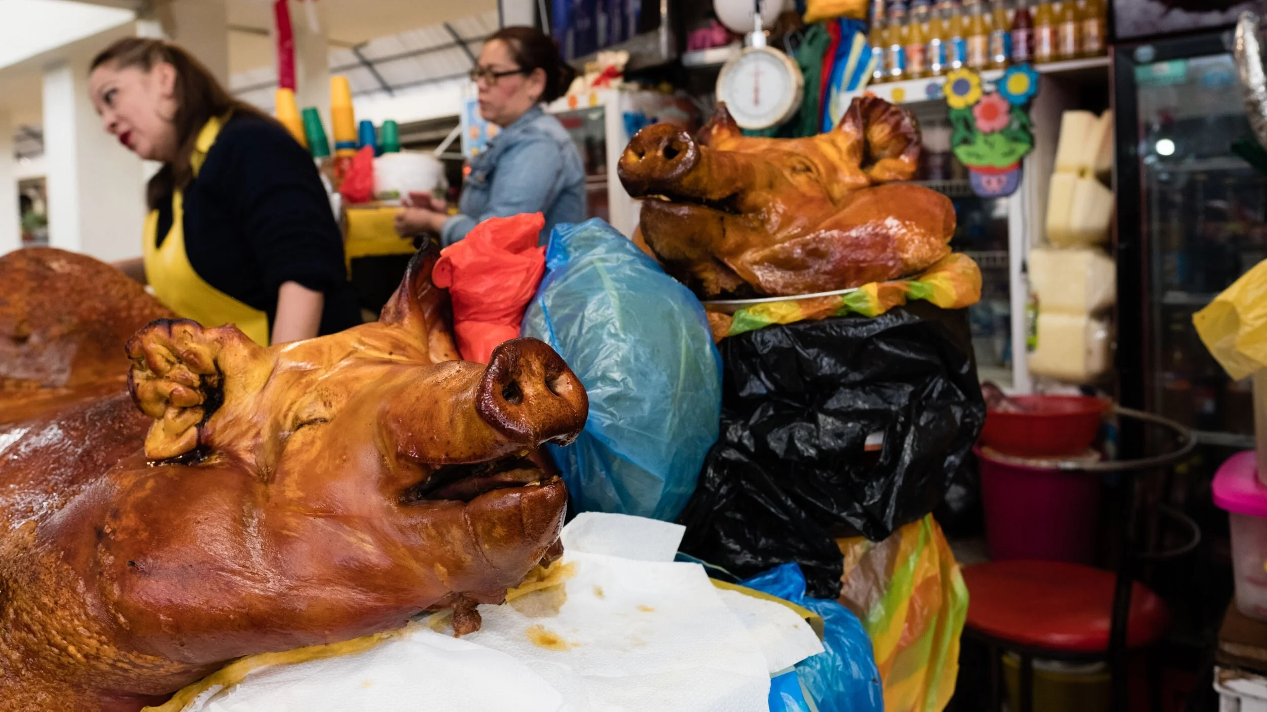guayaquil-ecuador-market-stall-whole-roast-pigs.jpg