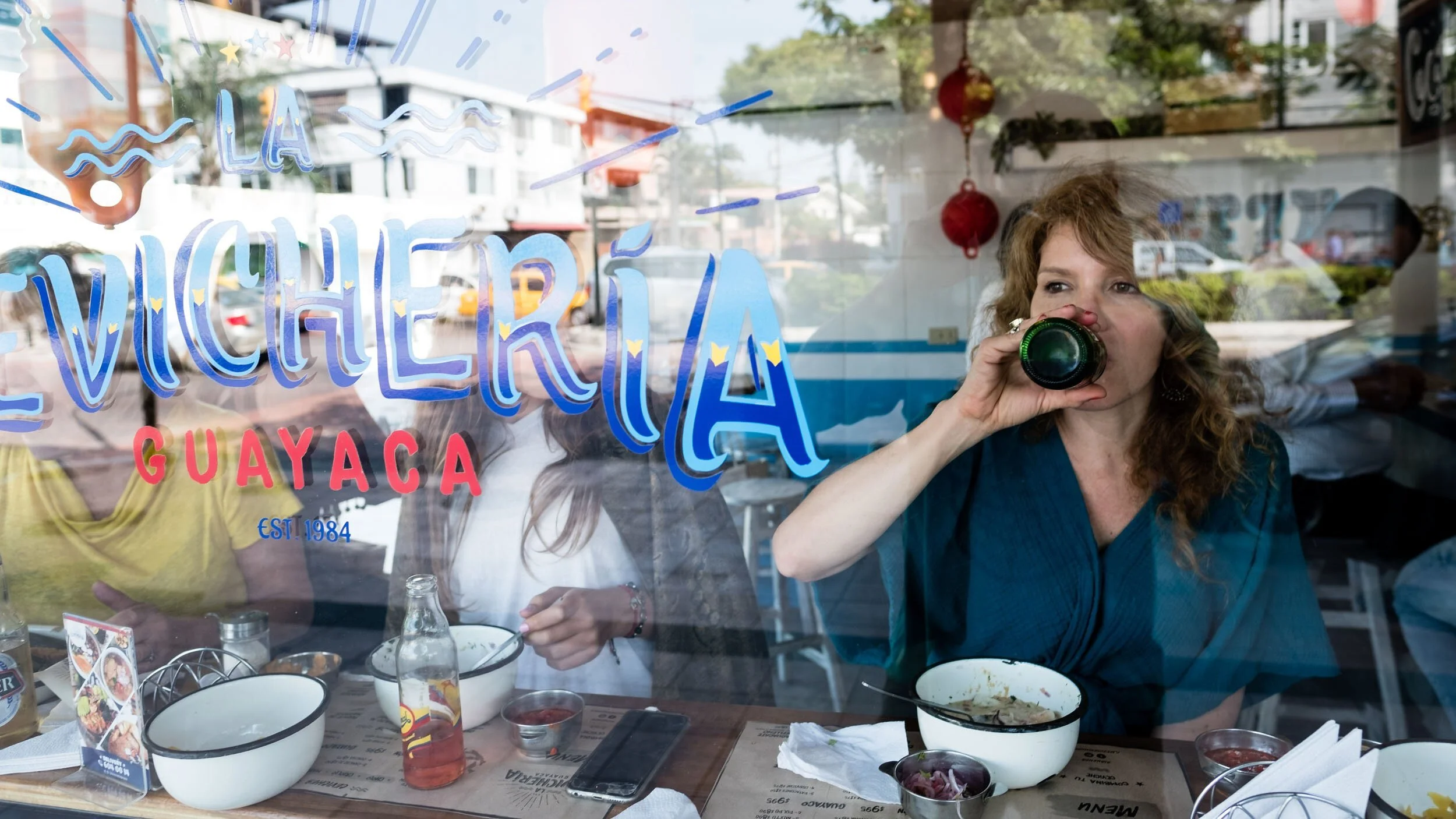 guayaquil-ecuador-woman-camera-cevicheria-window.jpg