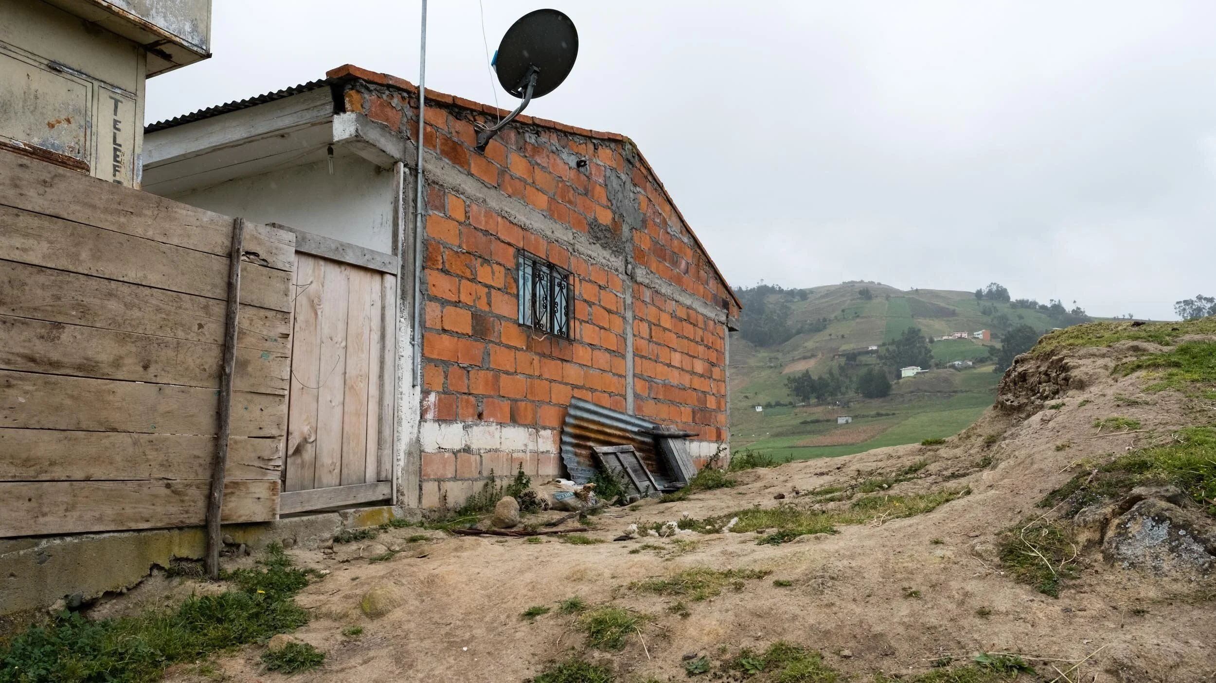 ecuador-andes-brick-house-green-hillside.jpg