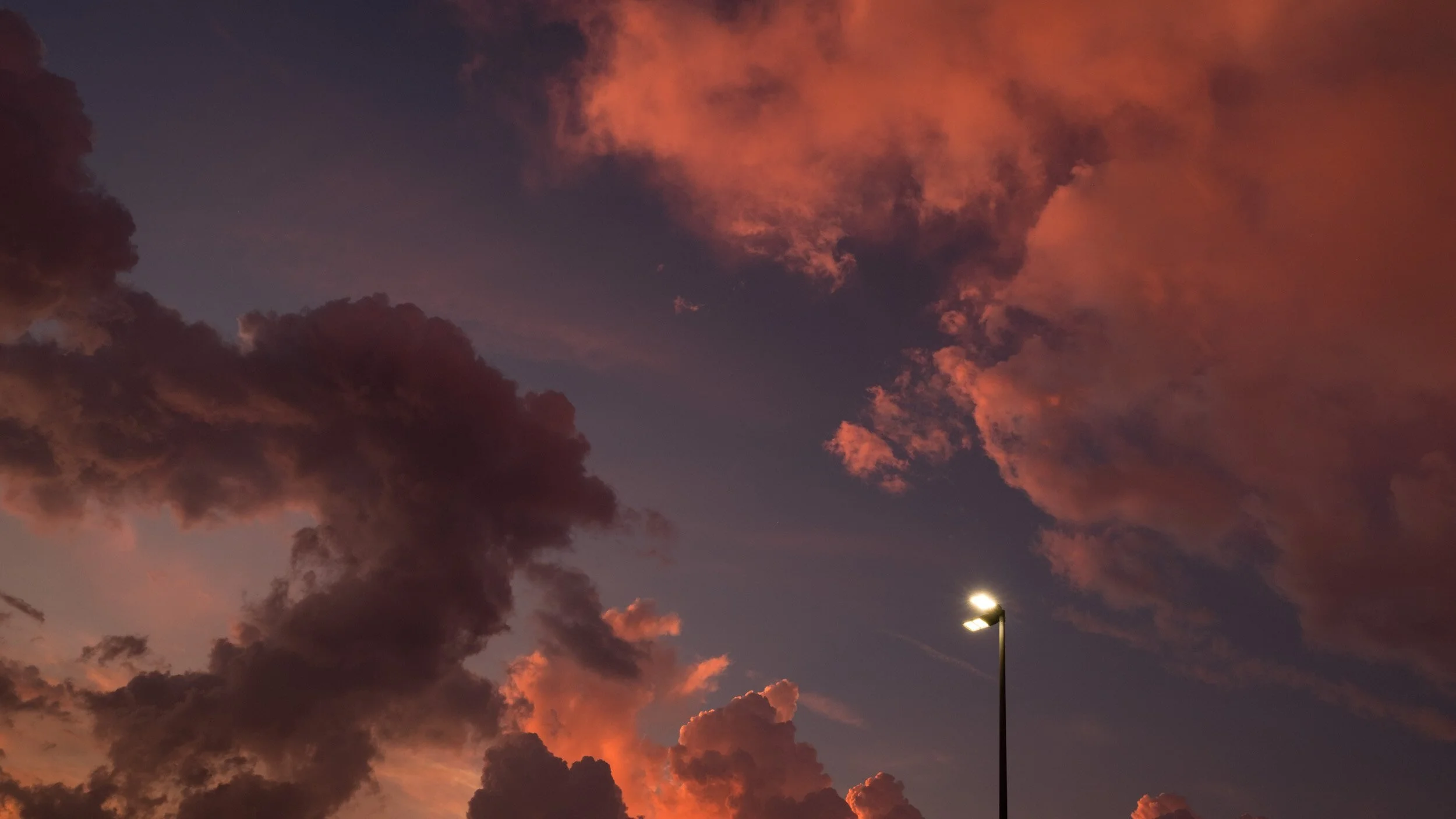 storm-clouds-orange-glow-lamp-post.jpg
