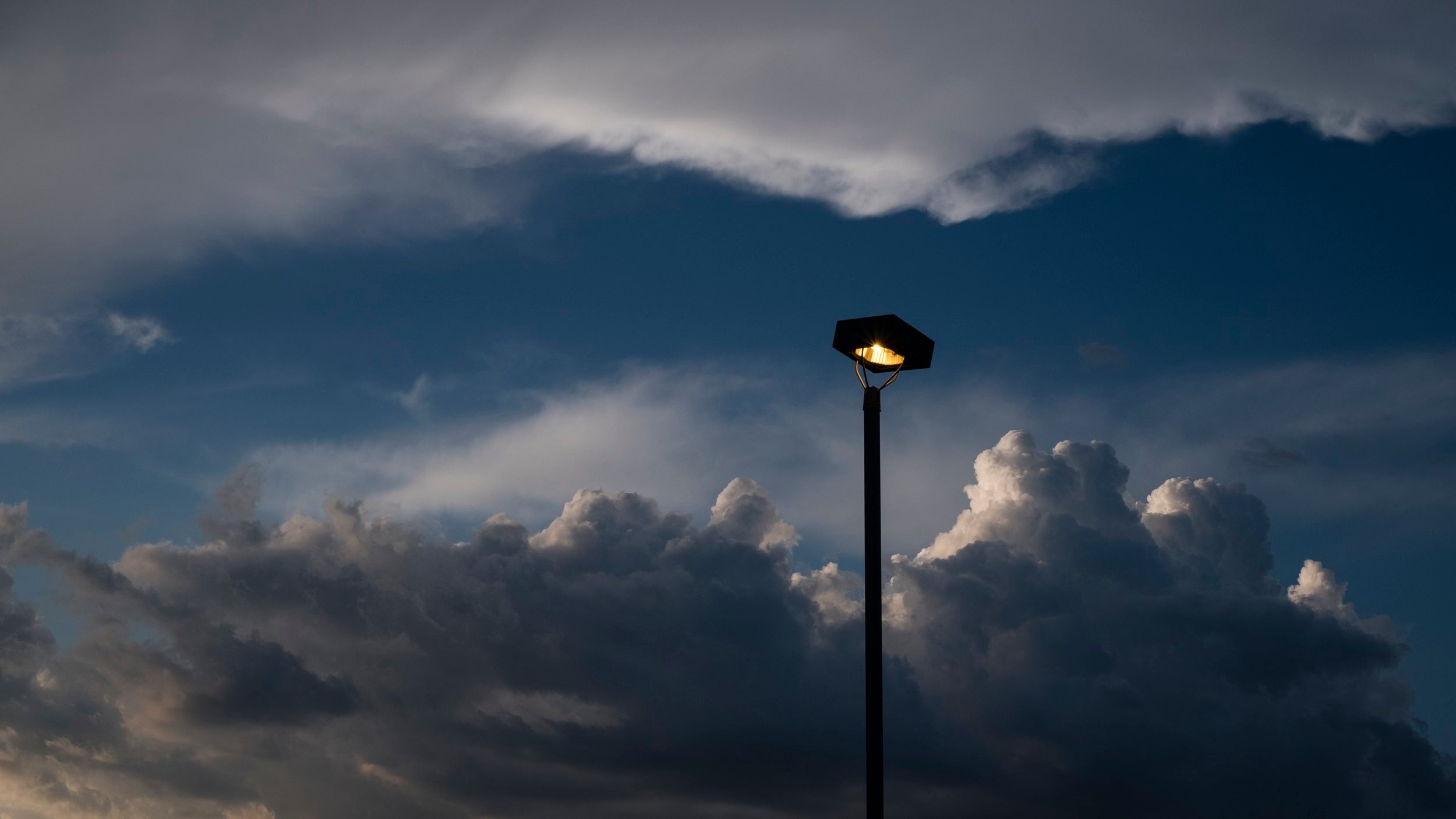 evening-cumulus-clouds-glowing-streetlight.jpg
