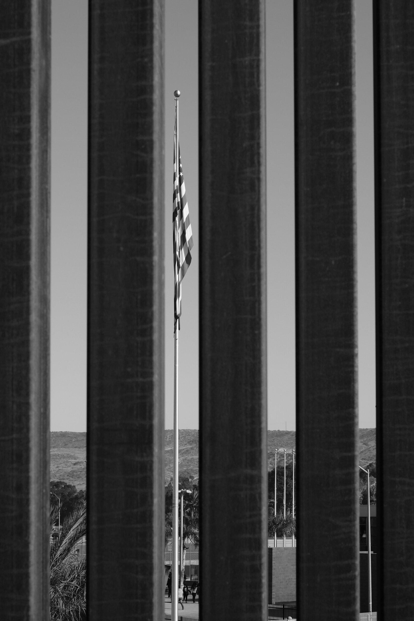 us-mexico-border-wall-american-flag.jpg