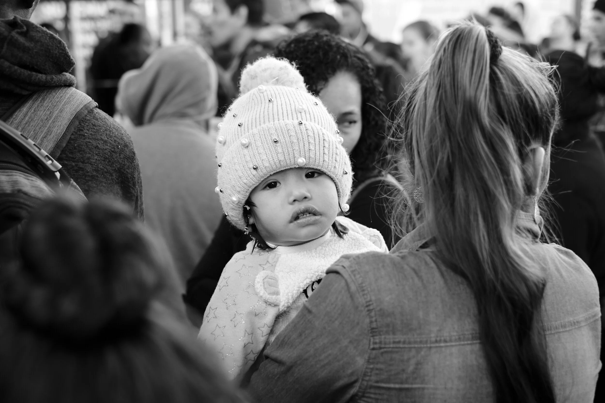 migrant-caravan-baby-in-crowd.jpg