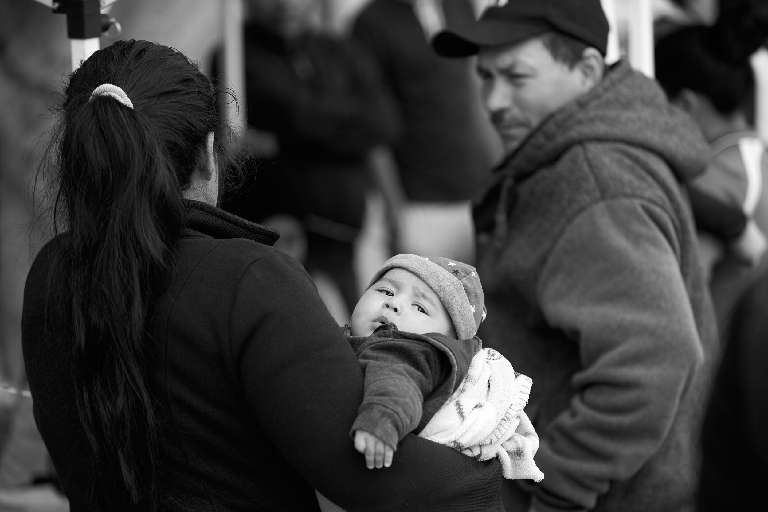 migrant-caravan-woman-holding-baby.jpg