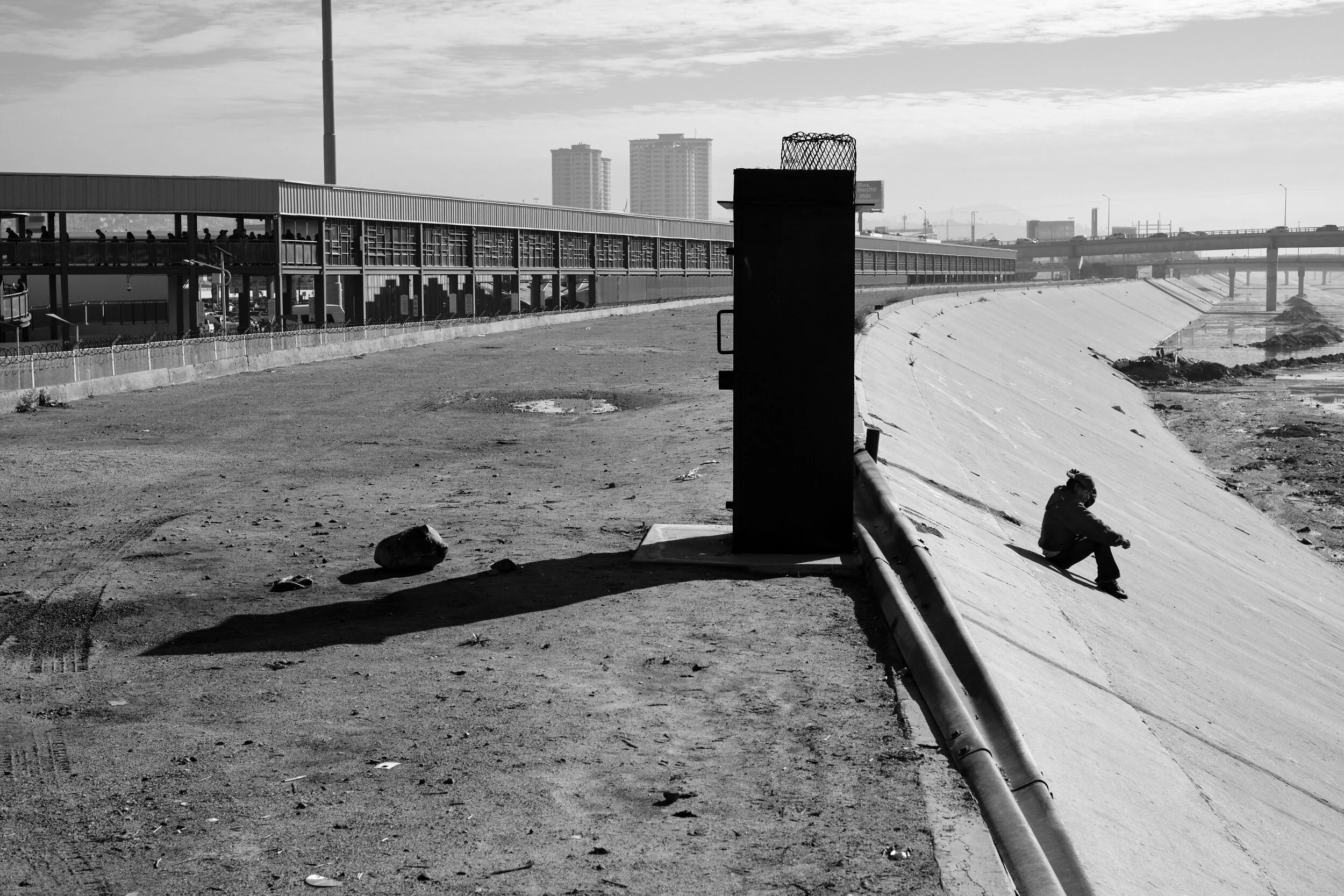 border-wall-concrete-channel-lone-figure.jpg