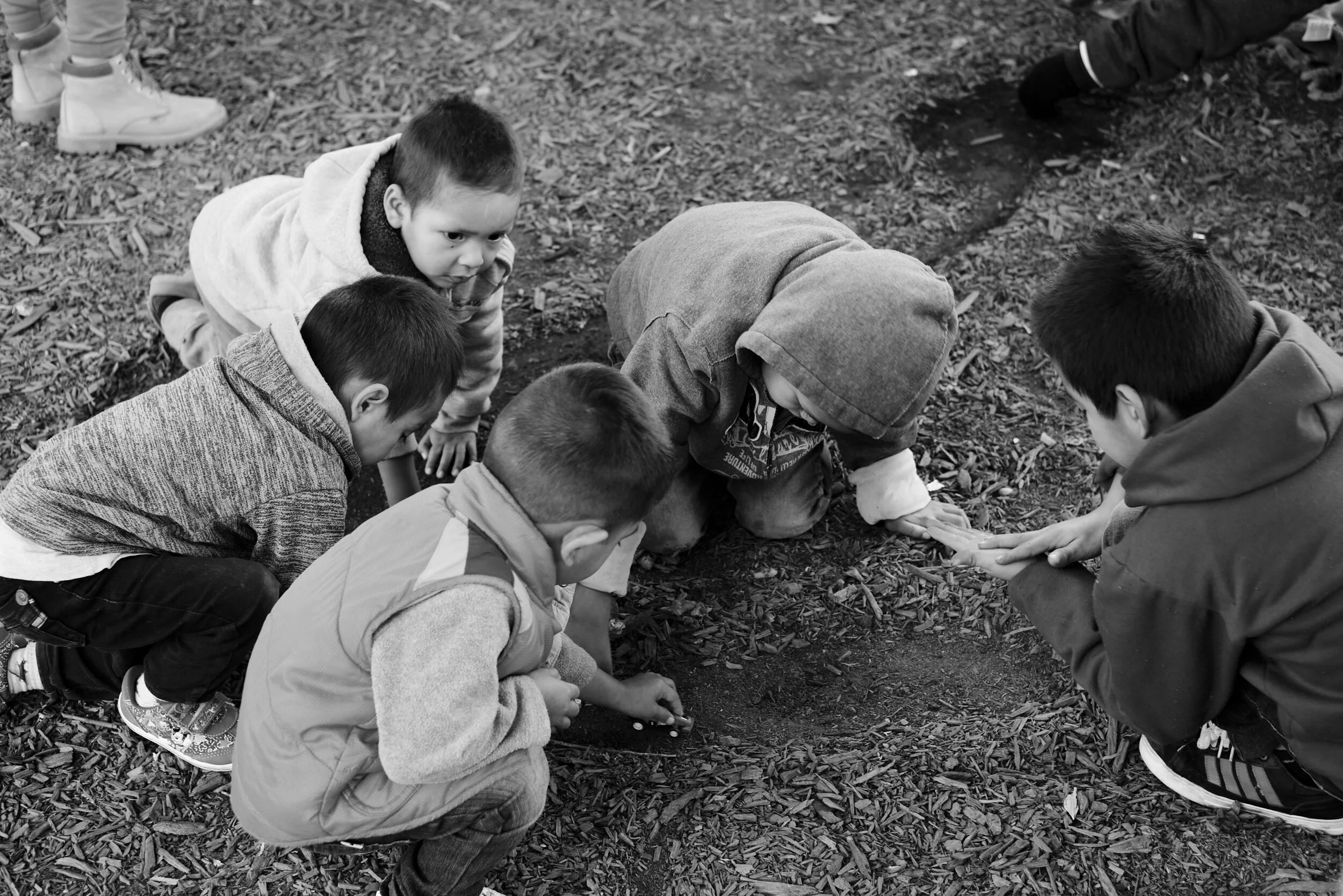migrant-children-playing-in-dirt.jpg