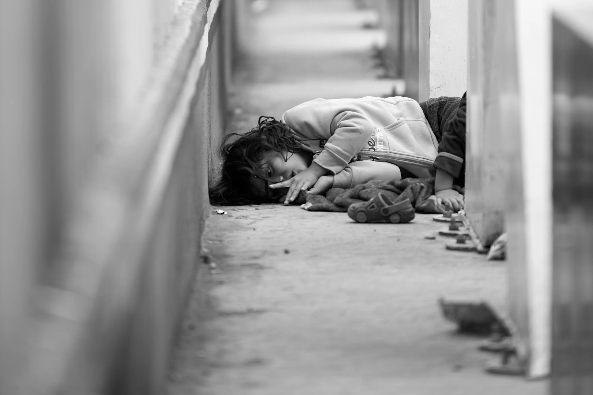 migrant-sleeping-on-walkway.jpg