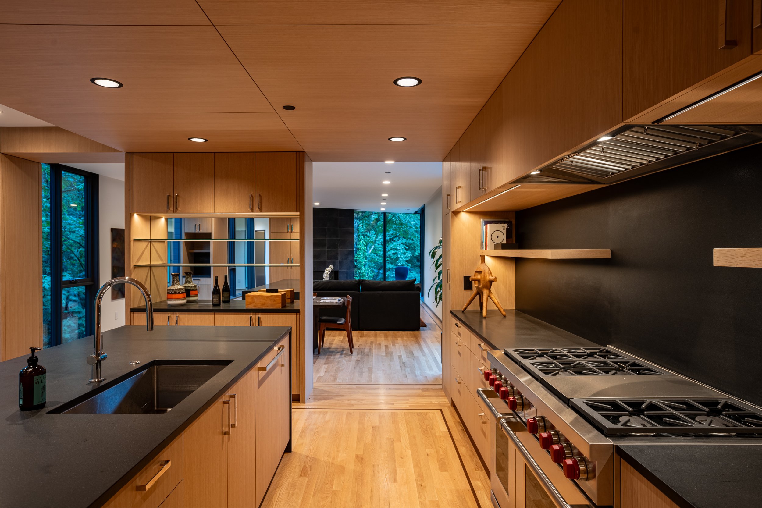 Open kitchen with view into living room — William Kaven Architecture