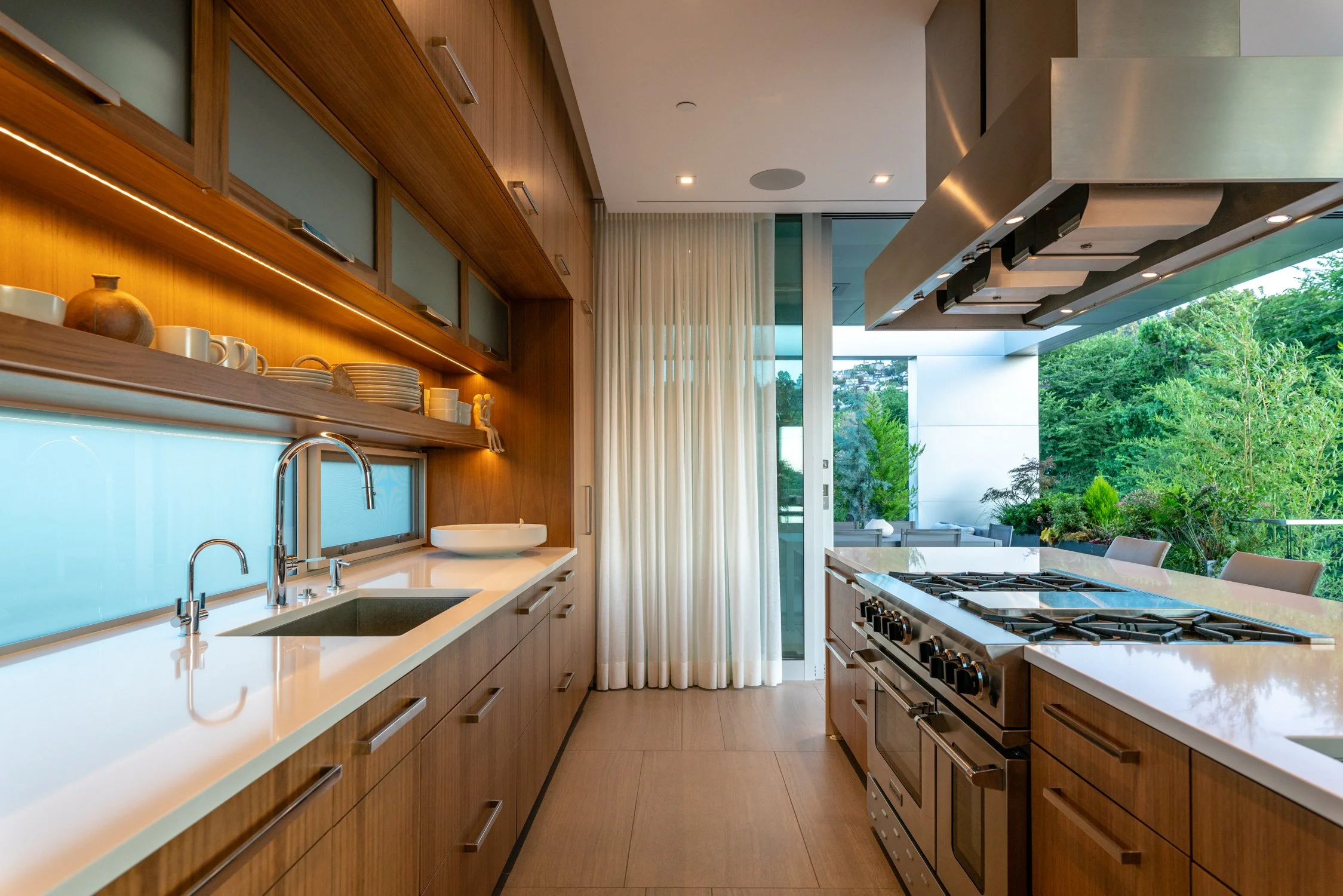 View of terrace from kitchen at Skyview, designed by William / Kaven Architecture.
