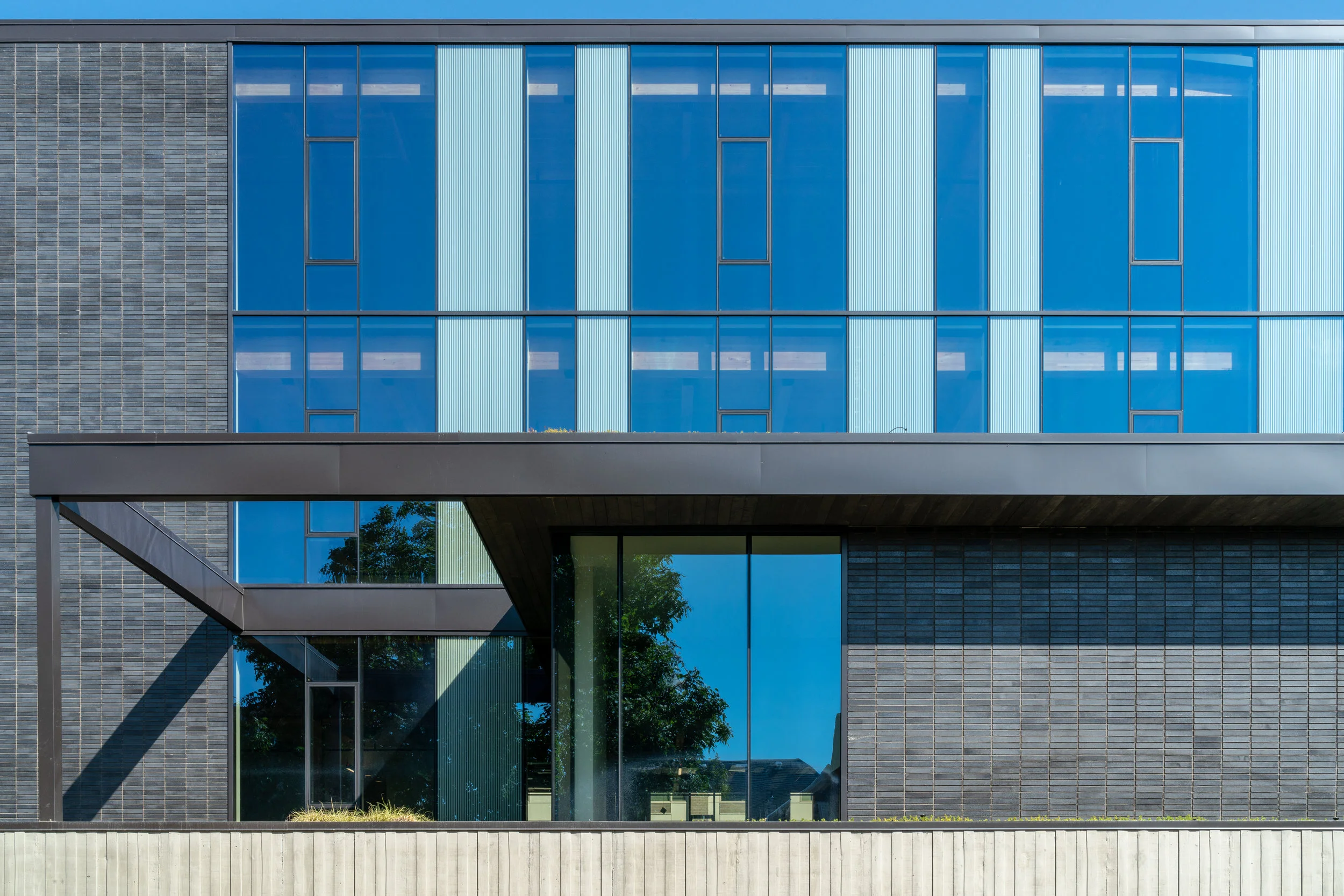 Detail of commercial building with dark brick in Portland, Oregon — William Kaven Architecture