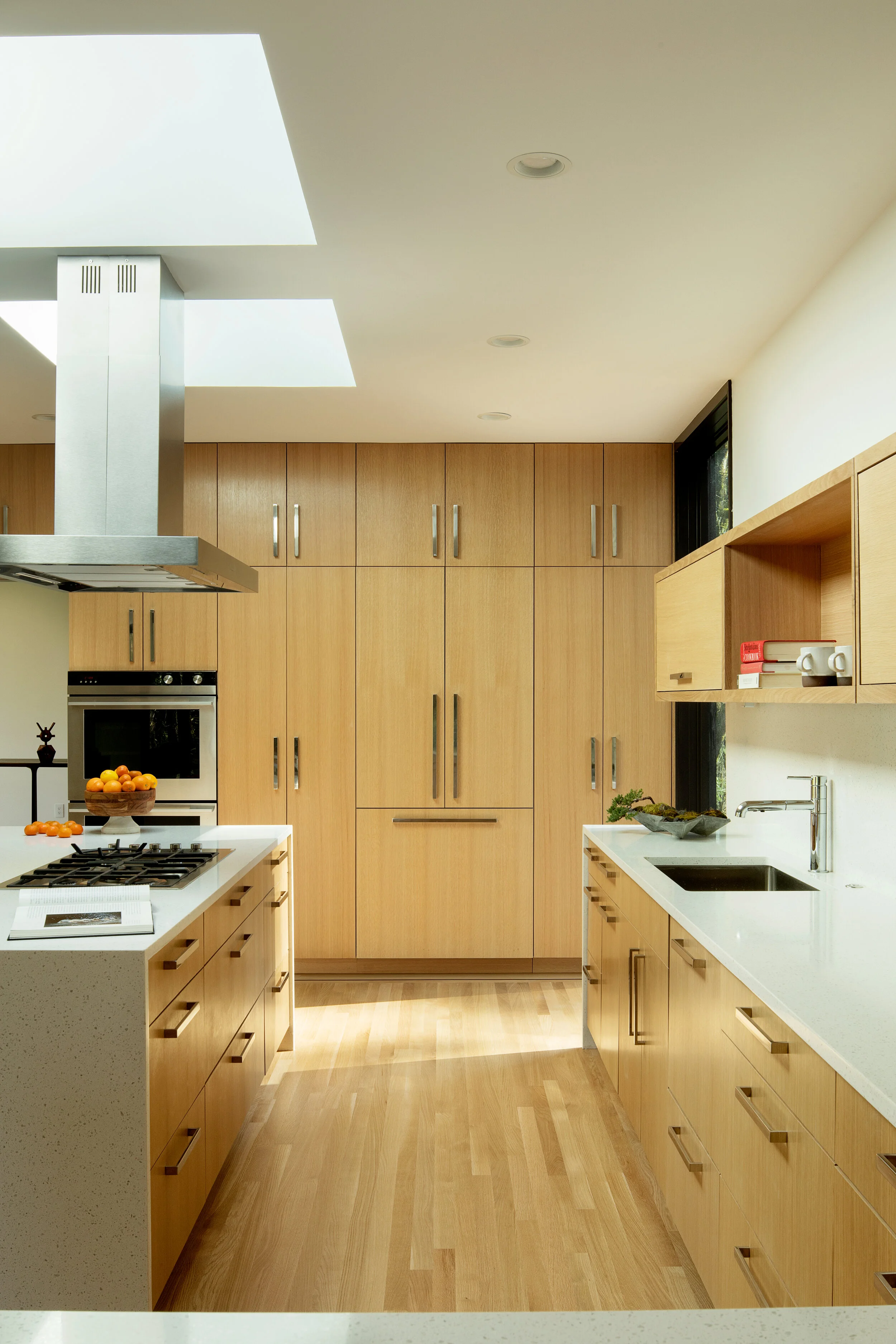 Kitchen with white oak floors and casework — William Kaven Architecture