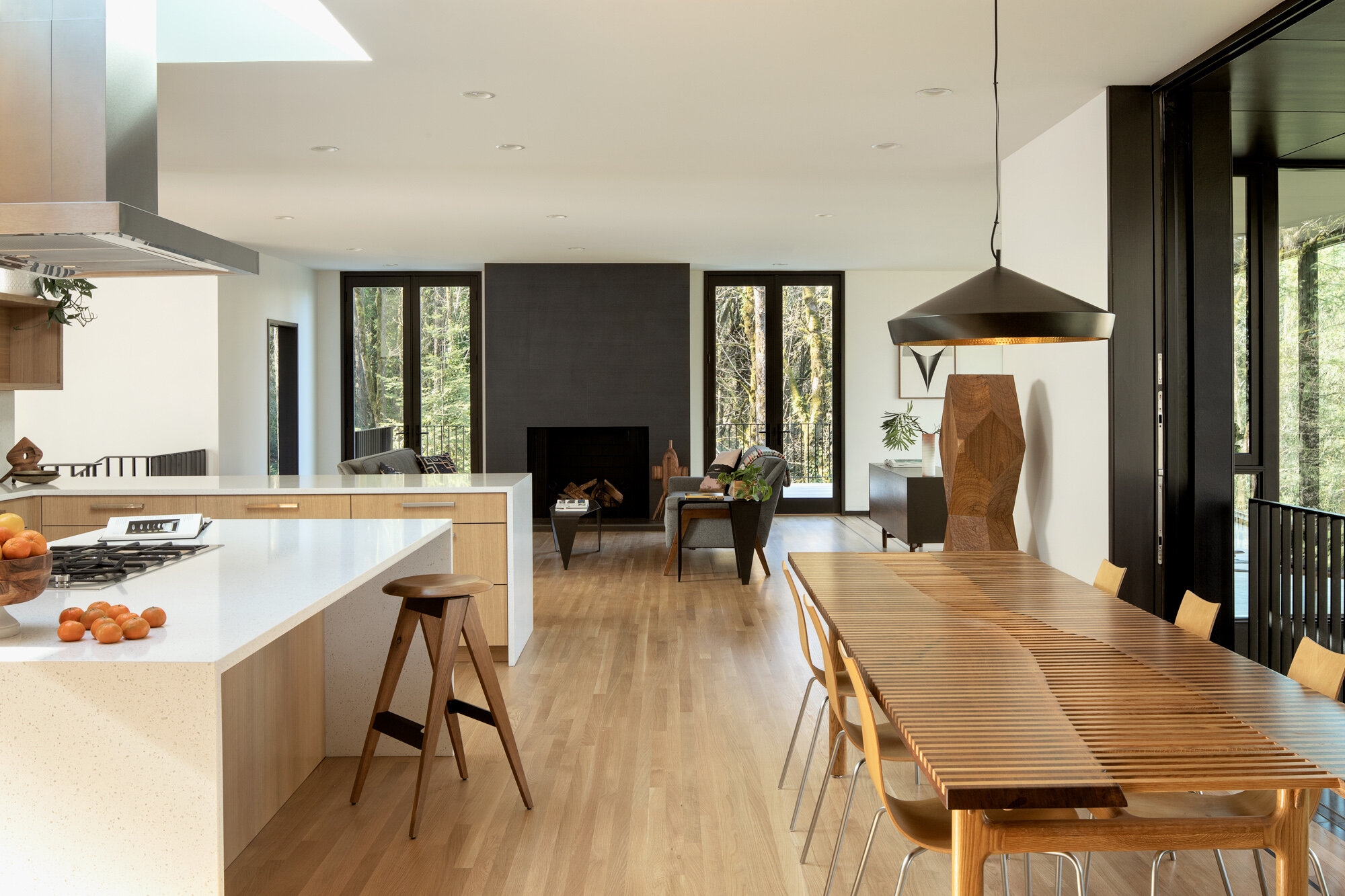 View of modern living room from kitchen — William Kaven Architecture
