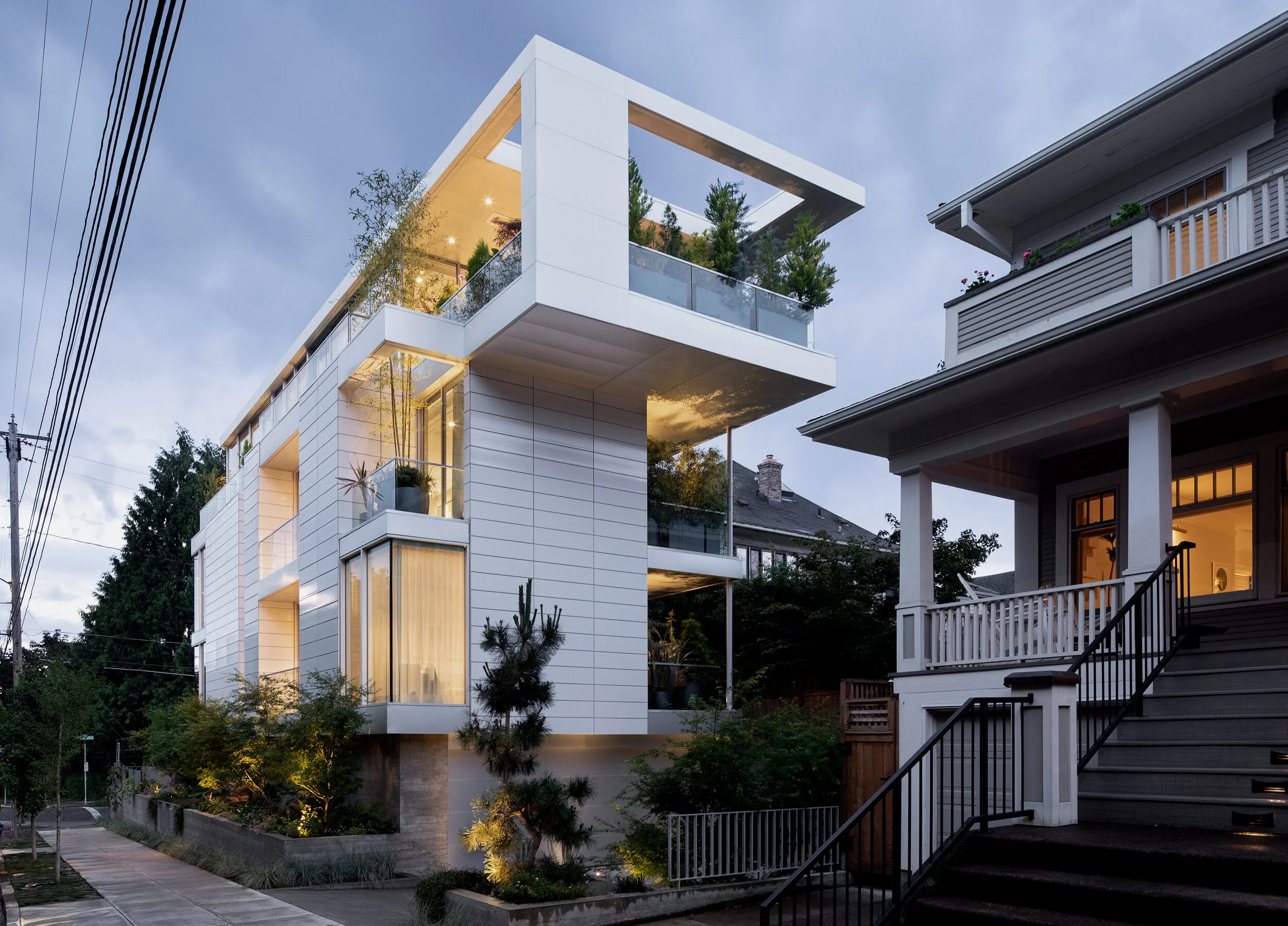 Modern house with white terracotta facade and planted terraces — William Kaven Architecture