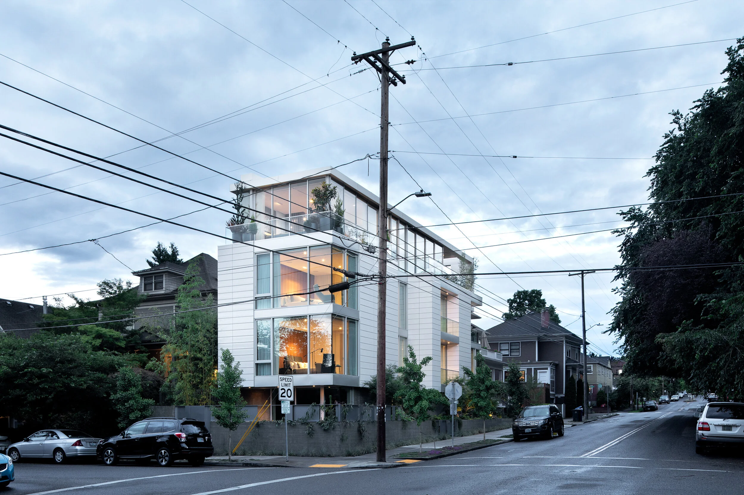 Modern house with white terracotta cladding and glass top level — William Kaven Architecture