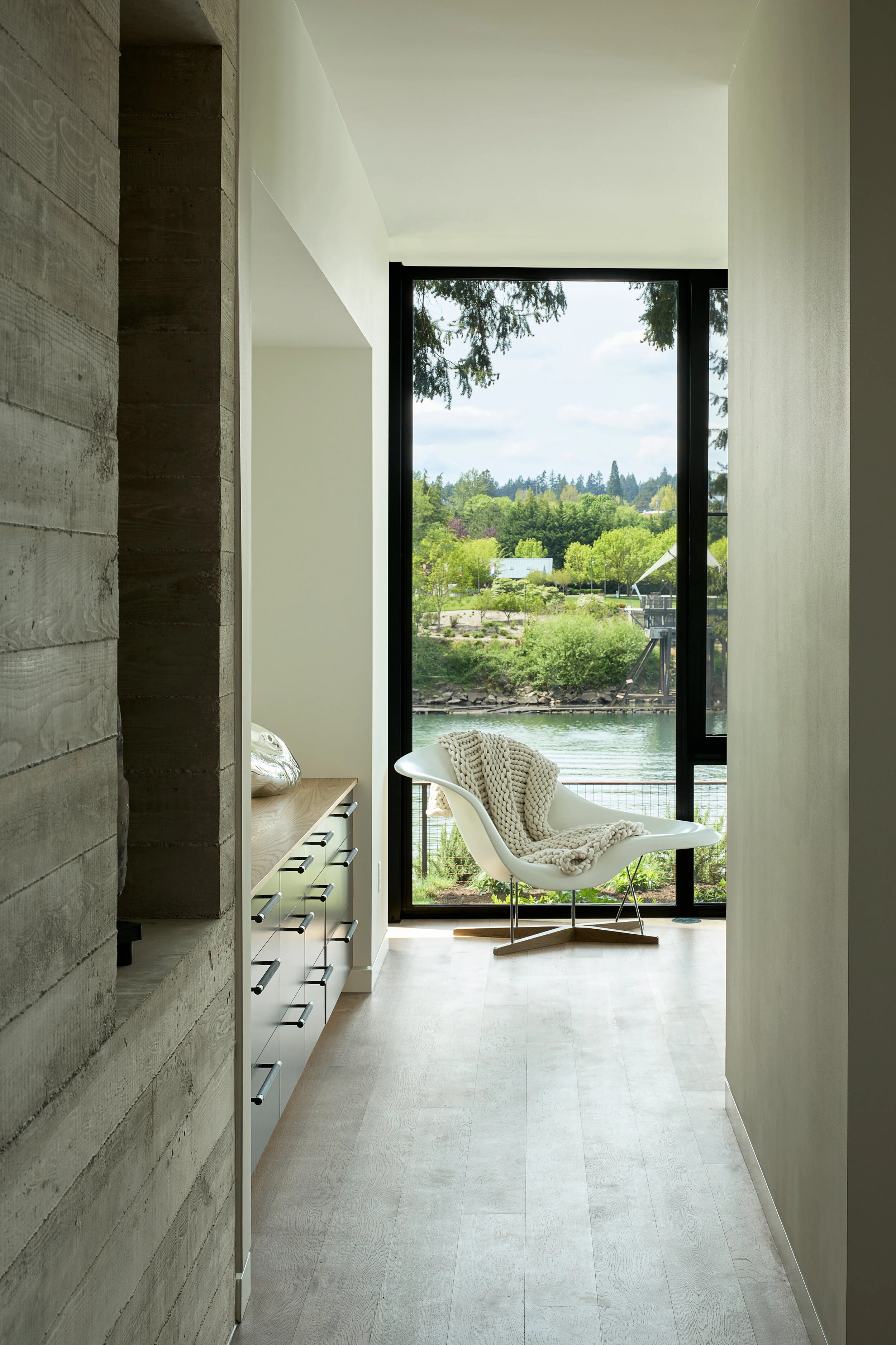 Hallway into bedroom with Eames La Chaise chair in corner — William Kaven Architecture