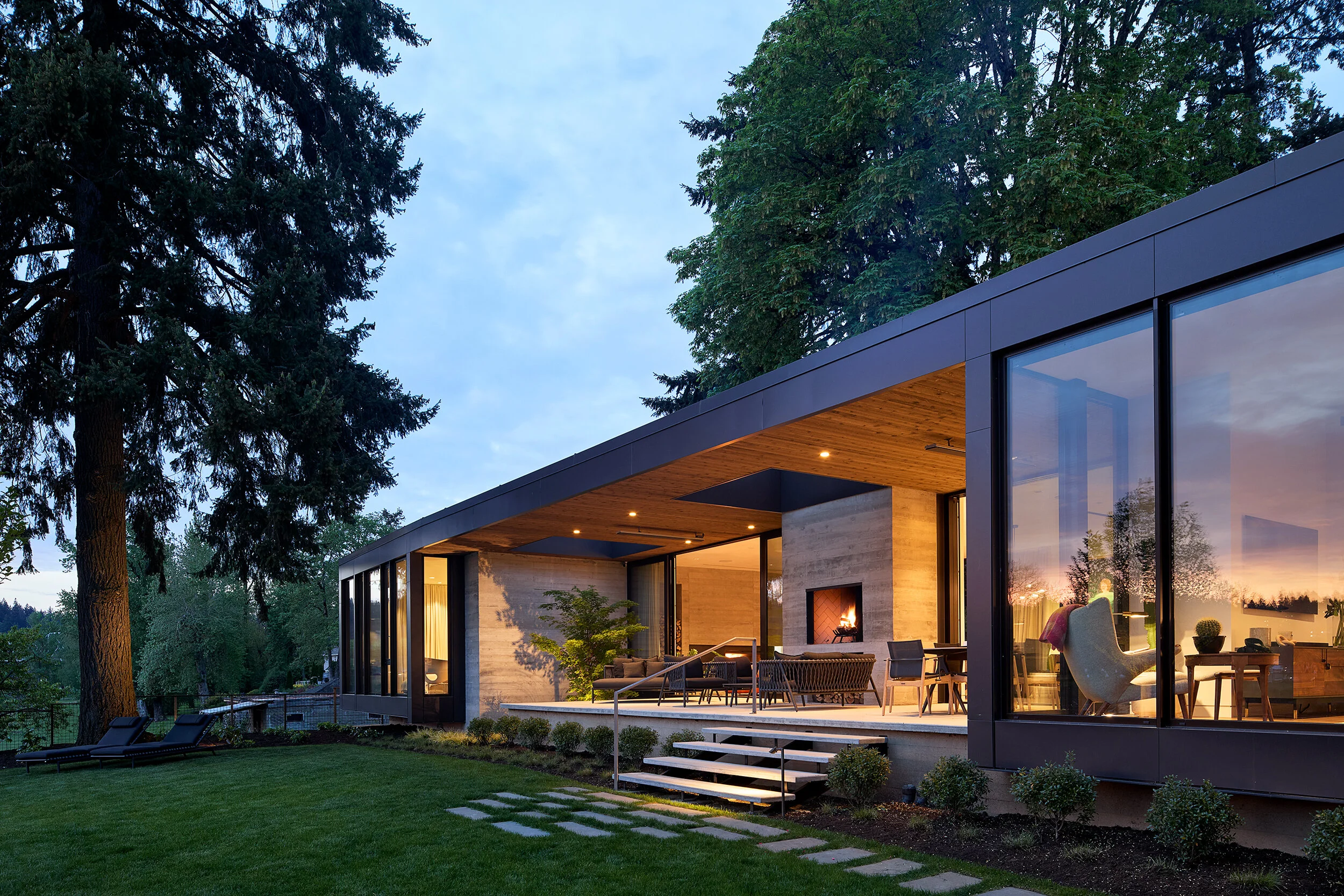 Modern home and lawn at dusk — William Kaven Architecture
