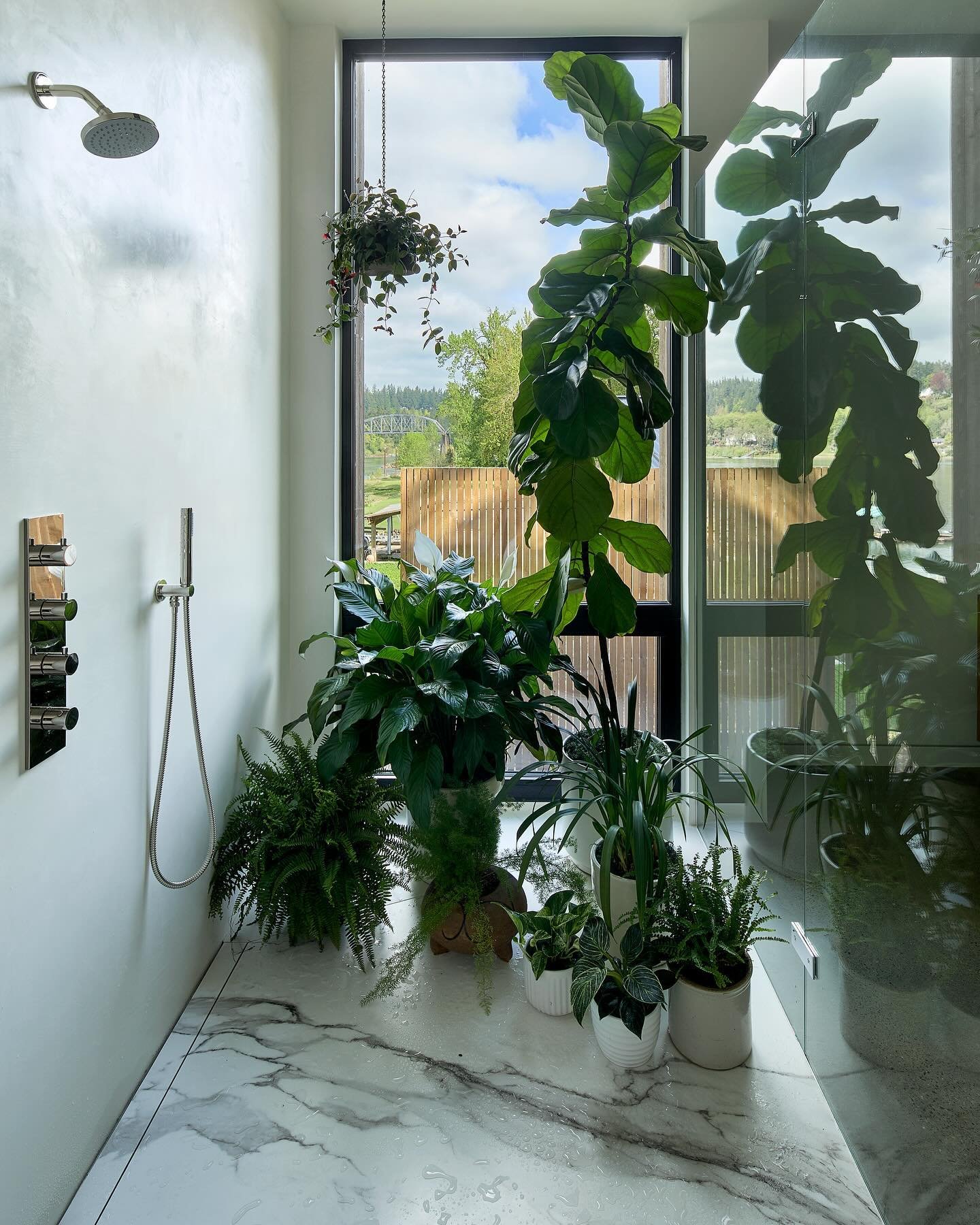 April showers bring May flowers... Here&rsquo;s a peek back at some of the showers we&rsquo;ve designed for our residential projects. 

1. The shower in the primary bathroom of our Heartwood Residence overlooks the Willamette River and an early 20th-