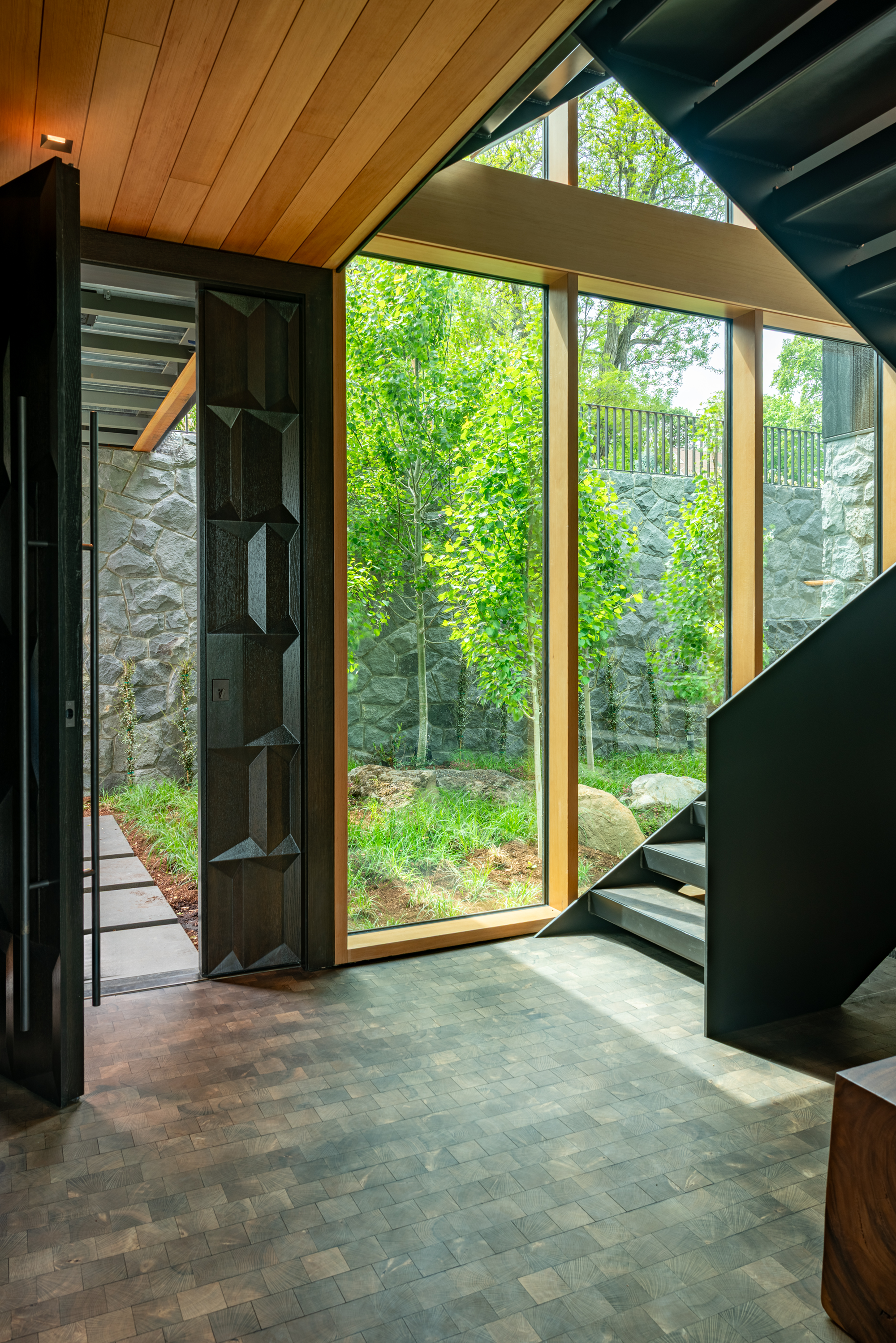 hood-river-residence-oregon-lower-entryway-custom-door-steel-stair-william-kaven-architecture