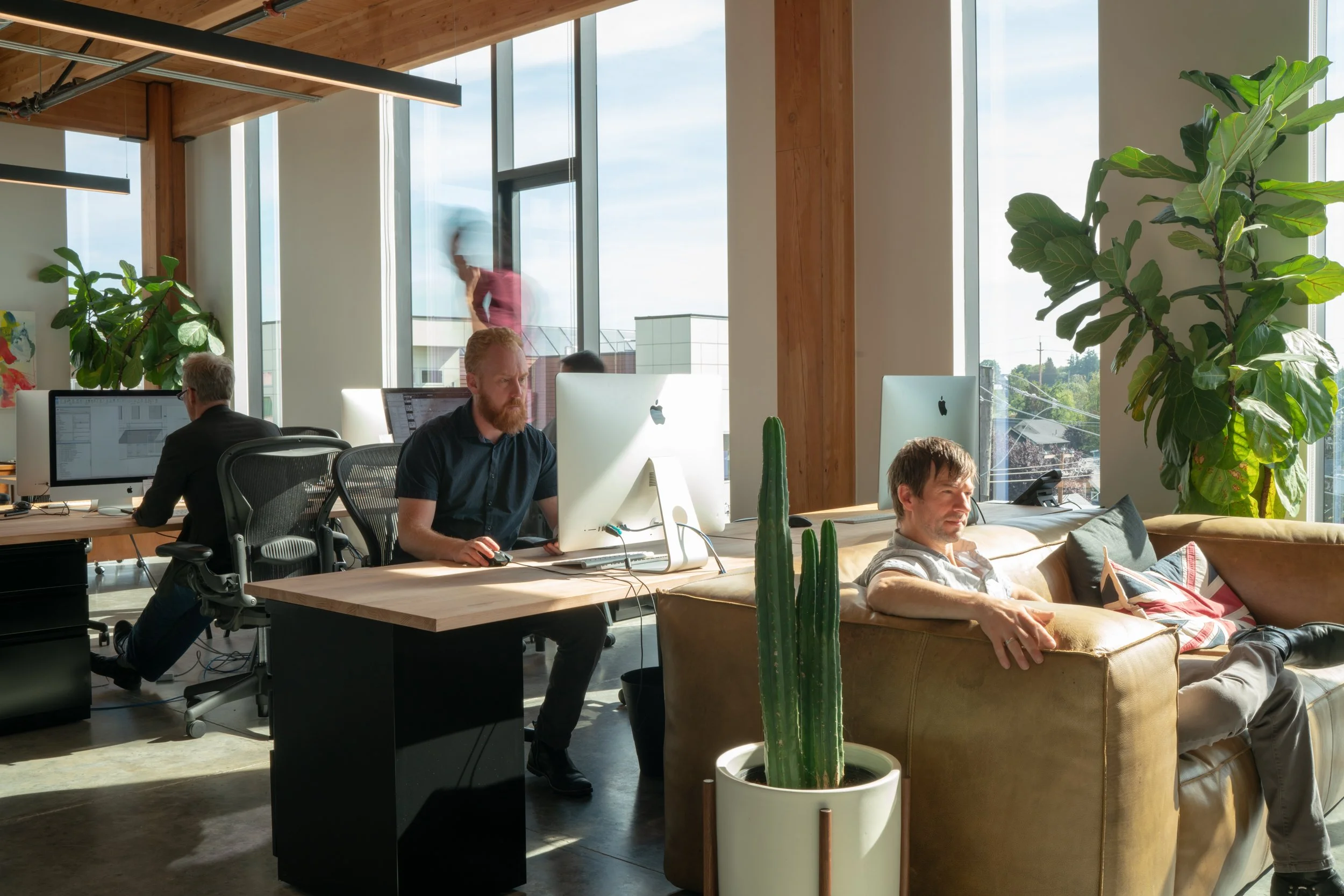 Employees working at William Kaven Architecture studio in Portland, Oregon's Silica building