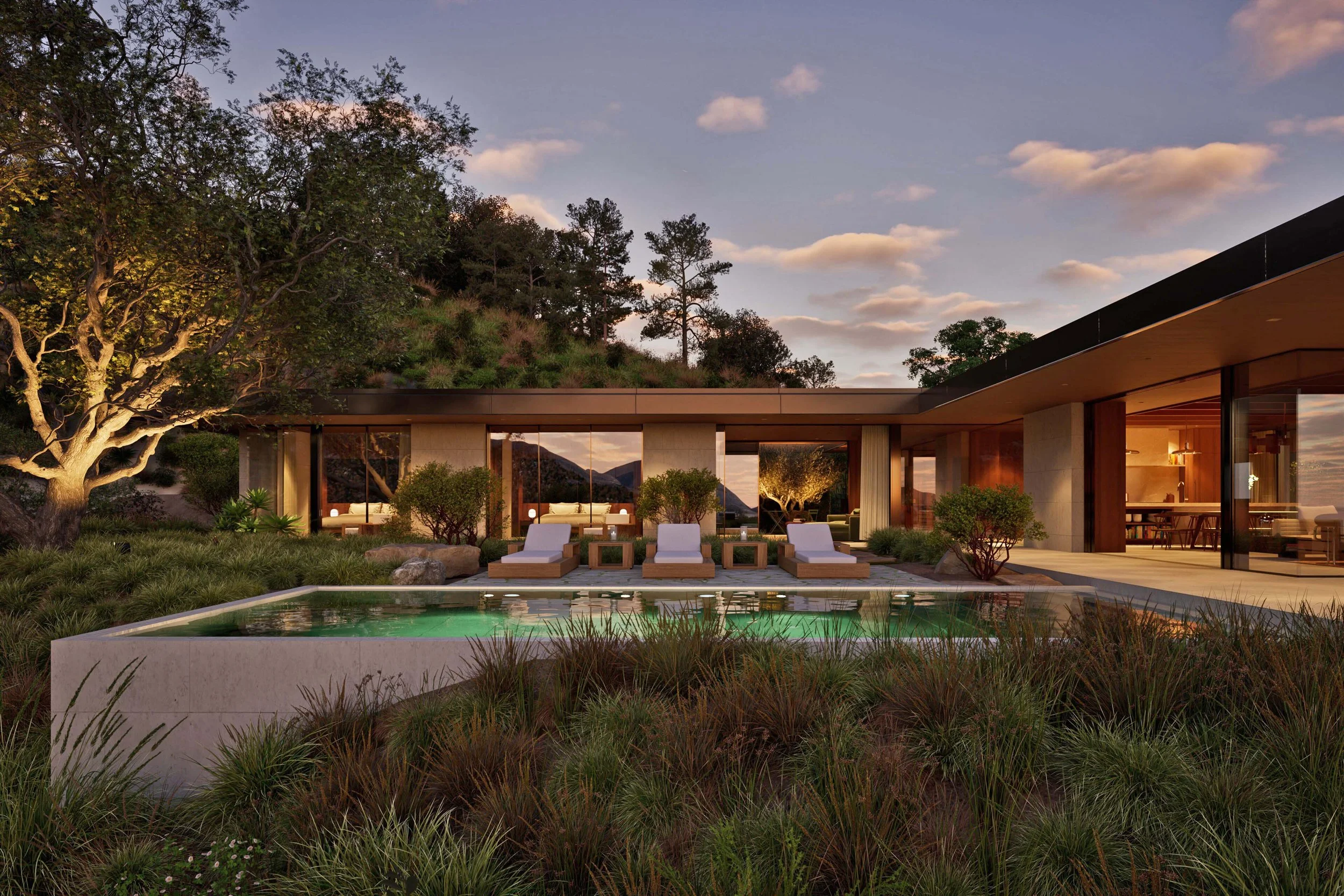 Swimming pool at dusk in Pacific Palisades with terrace and lounge chairs  — Miramar residence by William Kaven Architecture